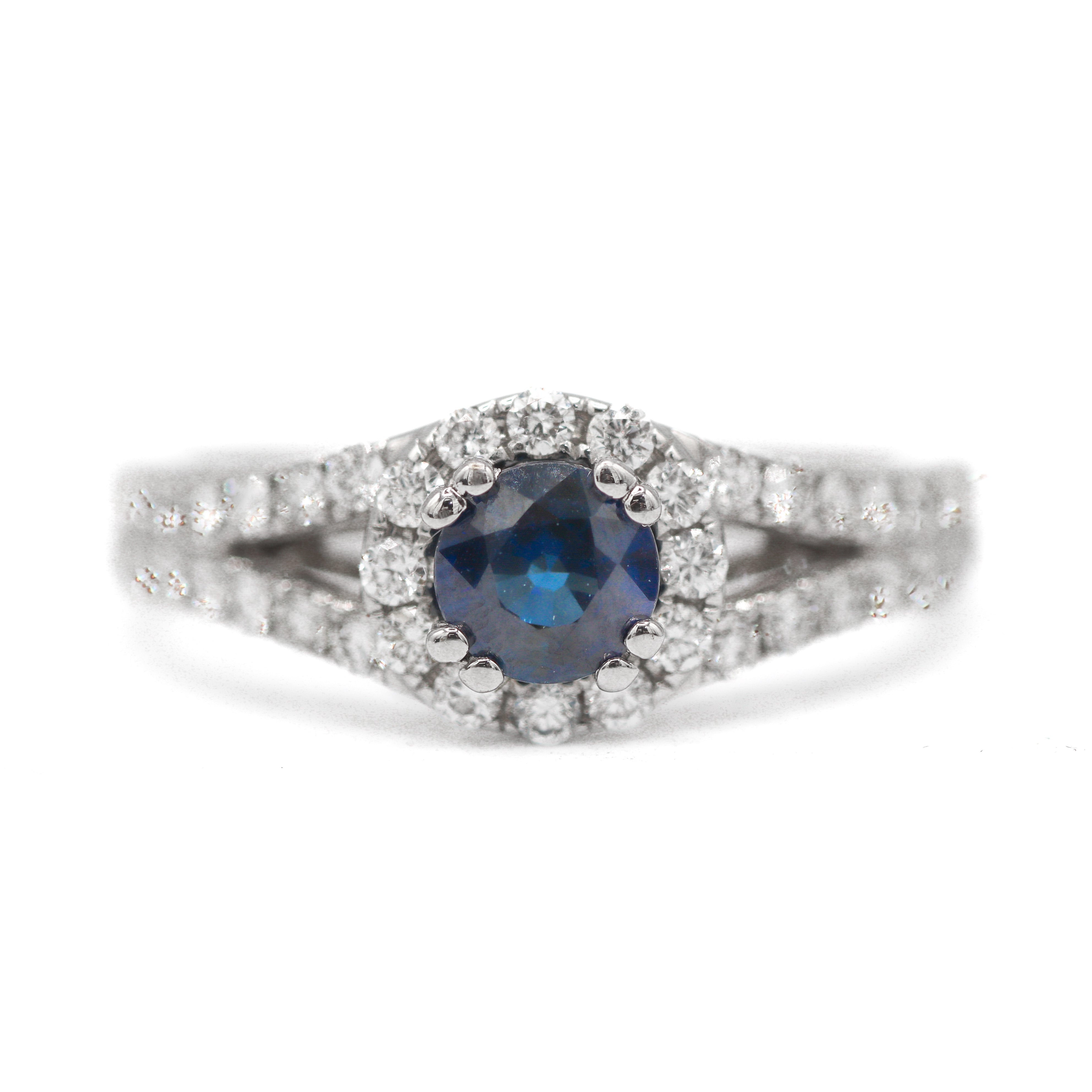 Front View of this 18K White Gold 5/8CT. Sapphire with 3/4CT. Diamond Halo Split-Shank Engagement Ring on a white background
