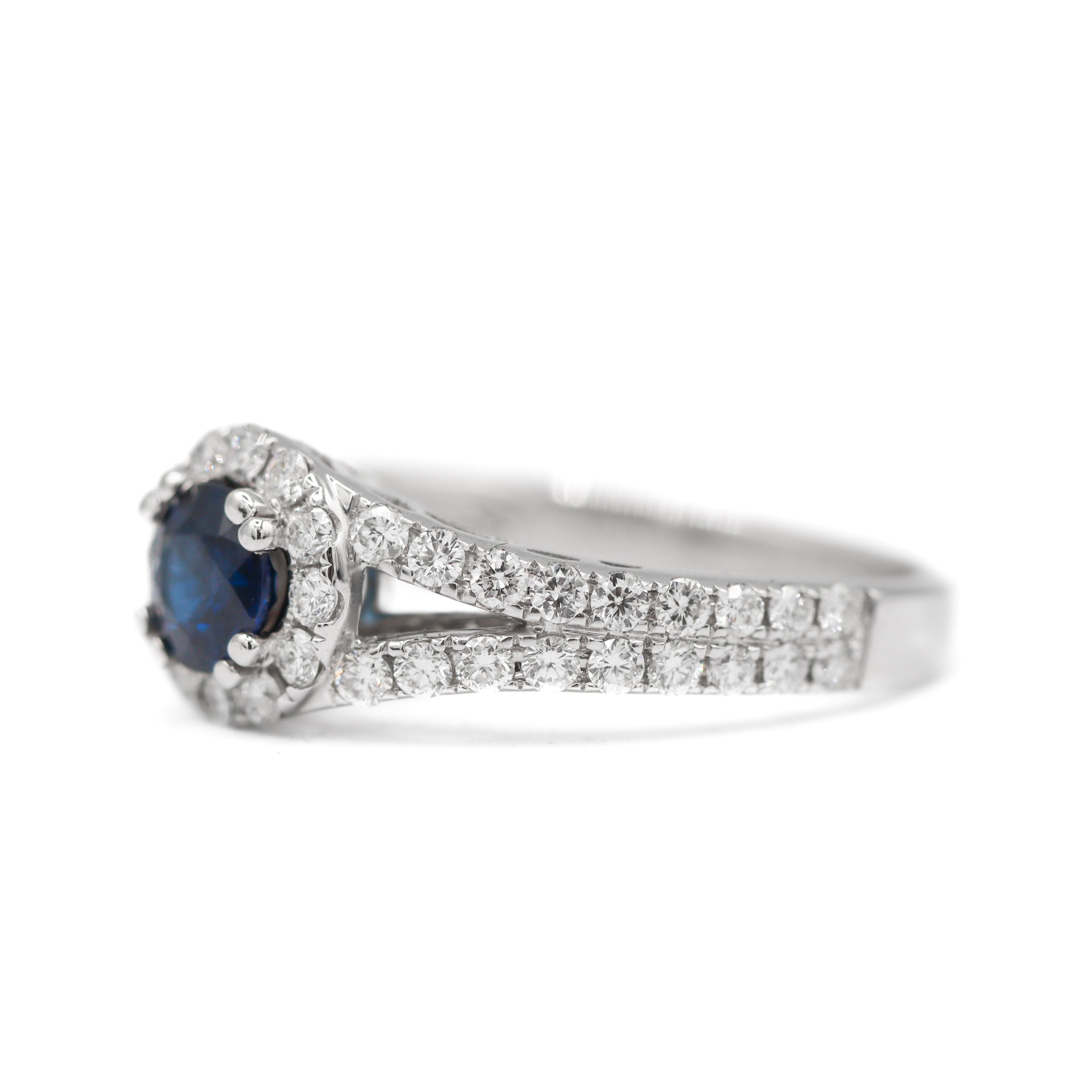 Left side view of 18K White Gold 5/8CT. Sapphire with 3/4CT. Diamond Halo Split-Shank Engagement Ring on white background.
