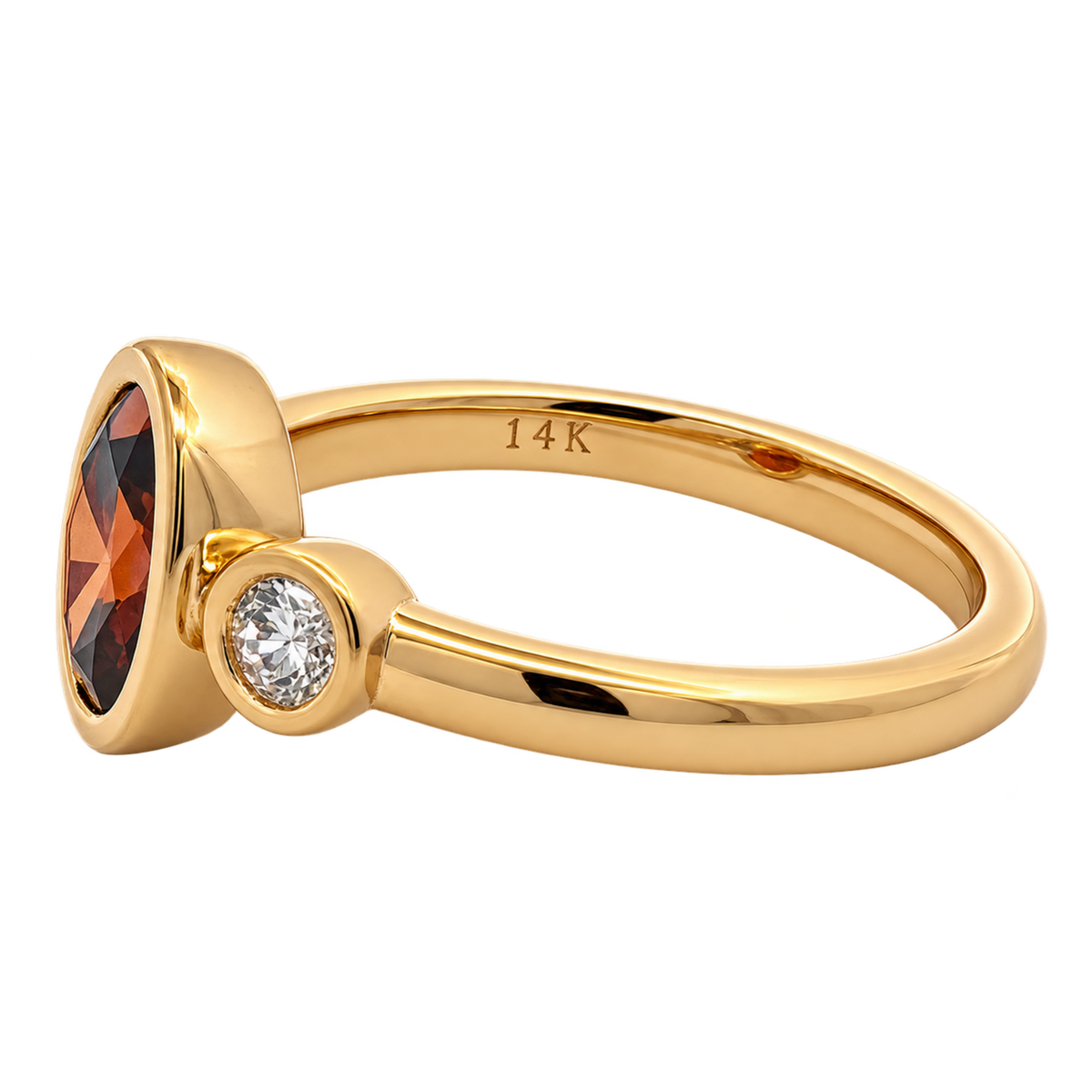 Left side view of RAHVW4-A 14K yellow gold ring showing the oval red lab-grown diamond bezel, round white lab-grown diamond accent, and 14K hallmark.