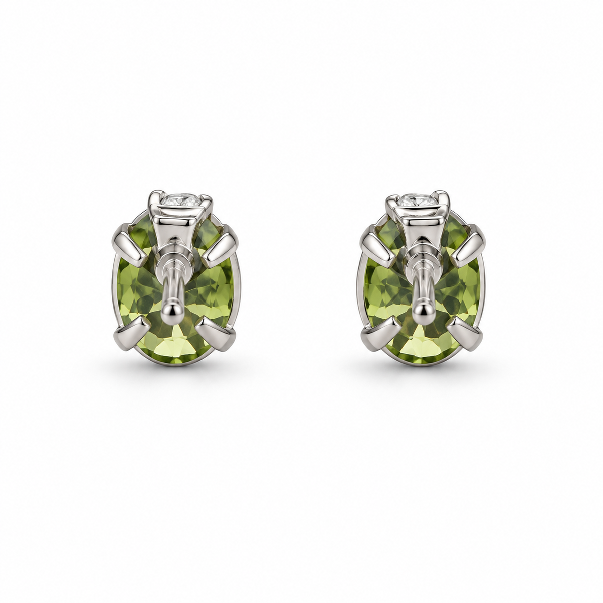 Back view of 14K white gold oval peridot and diamond stud earrings on a white background