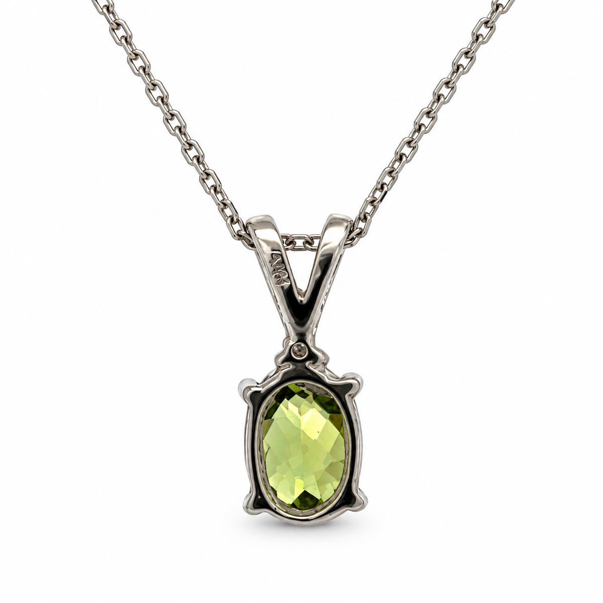 Back view of 14K white gold oval peridot and diamond pendant necklace on a white background