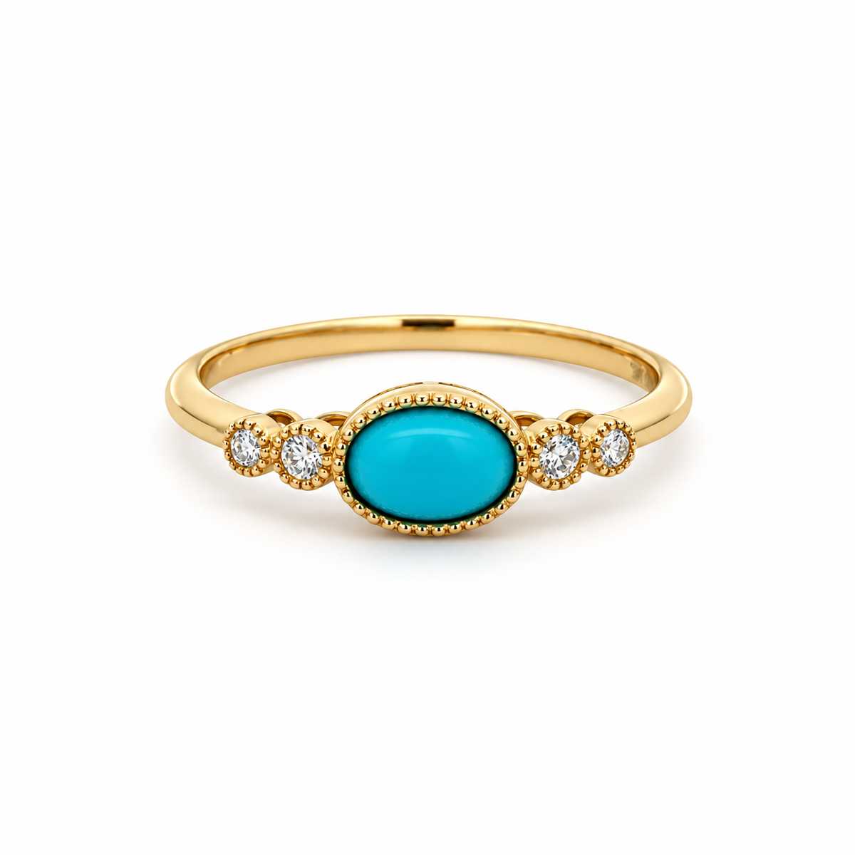 Front view of a 14K yellow gold ring with an oval turquoise cabochon and four diamond accents in decorative bezel settings.