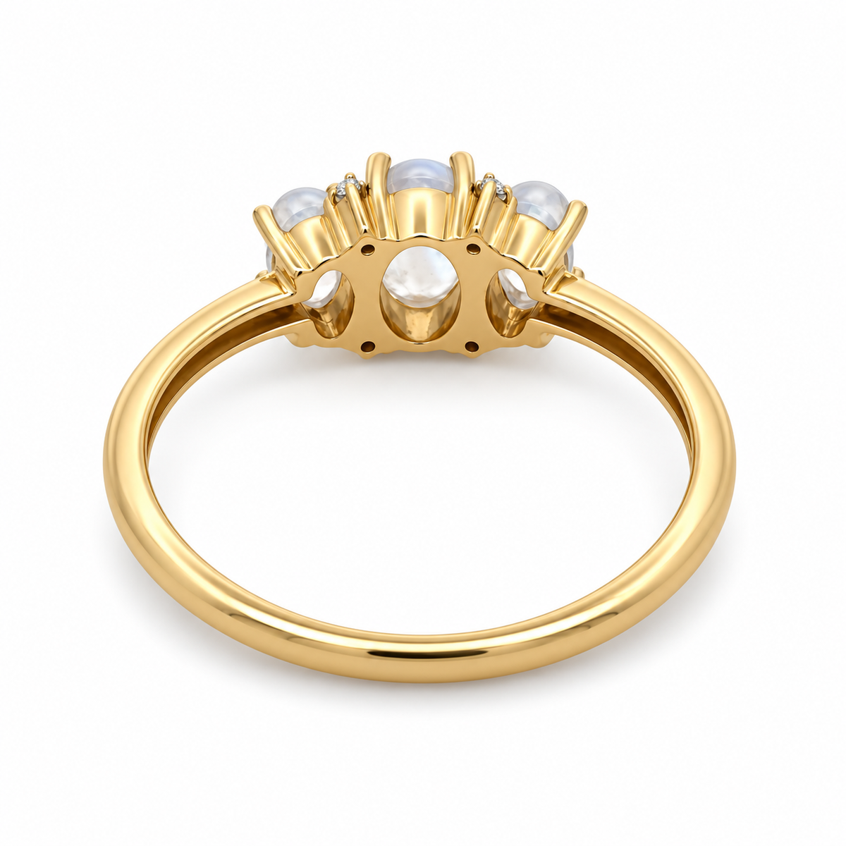 Back view of a 14K yellow gold three-moonstone ring showing the open gallery beneath the gemstones and polished band.