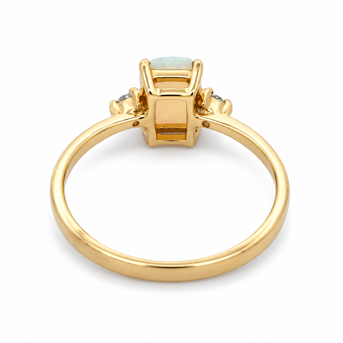 Back view of a 14K yellow gold opal and diamond ring showing the open setting and polished gold band