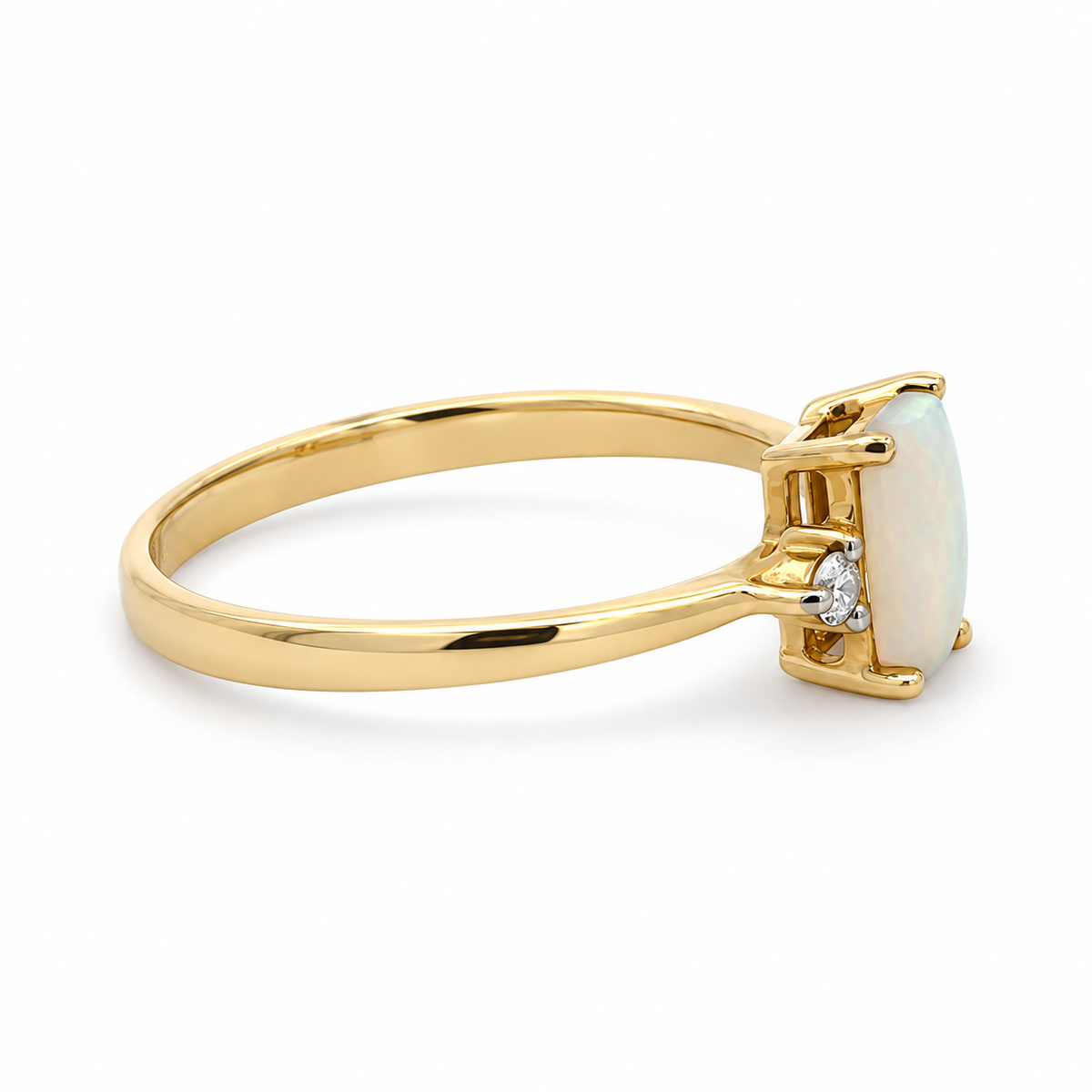 Side view of a 14K yellow gold opal and diamond ring showing the raised prong setting and polished band
