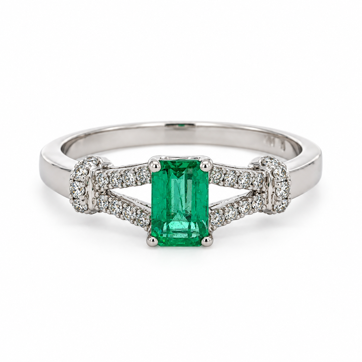 Front view of a 14K white gold ring with a 0.45 CT. emerald and 0.15 CTW. diamond accents on a white background
