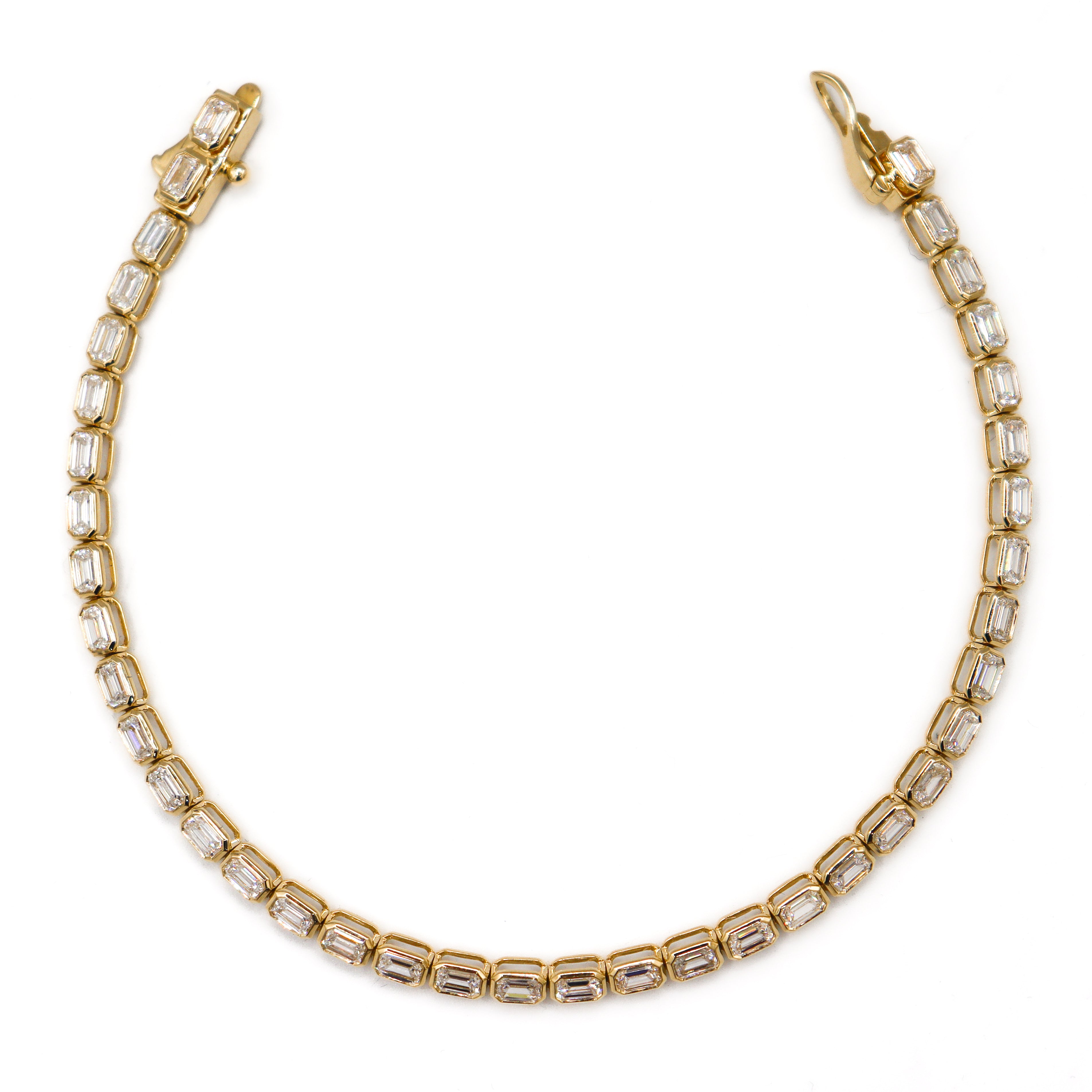 Image showing tennis bracelet laying flat on a white background, open.