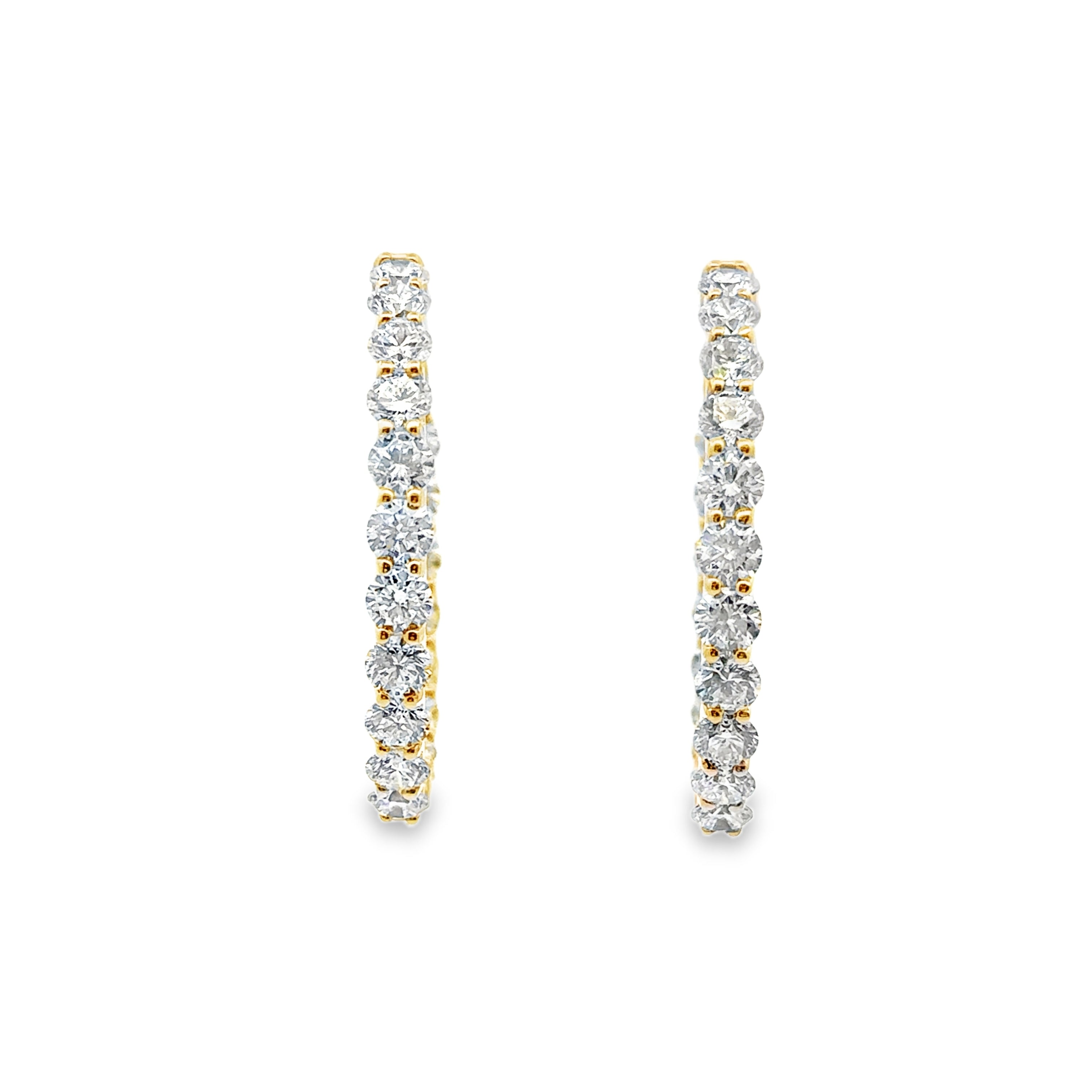 Pair of diamond hoop earrings on a white background