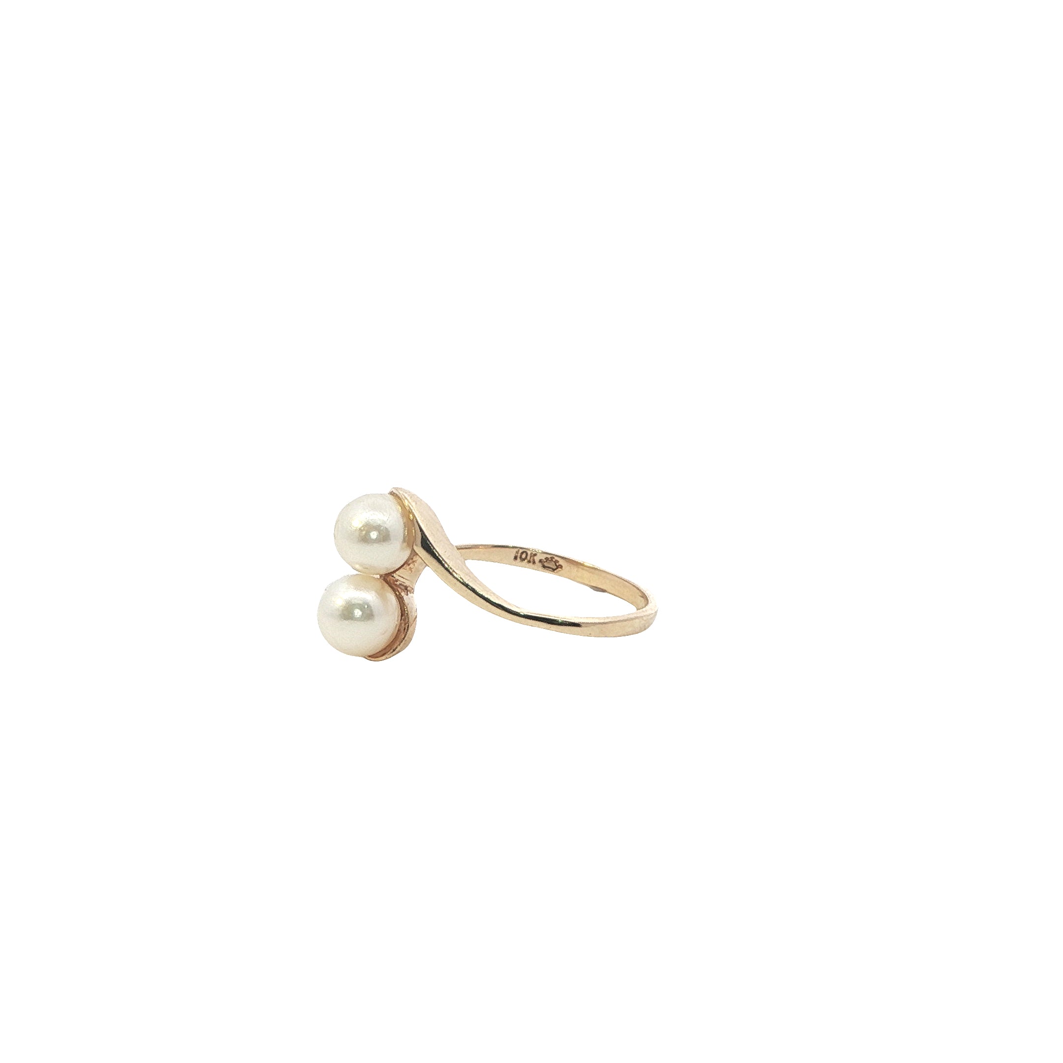 Gold ring with two pearls on a white background