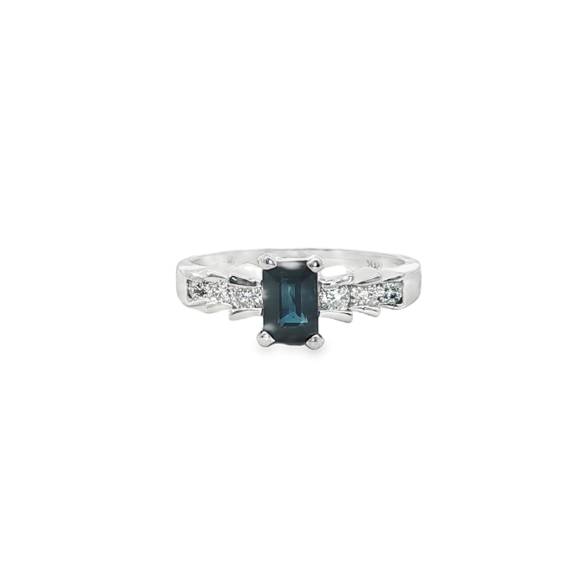 Silver ring with a blue gemstone and diamonds on a white background