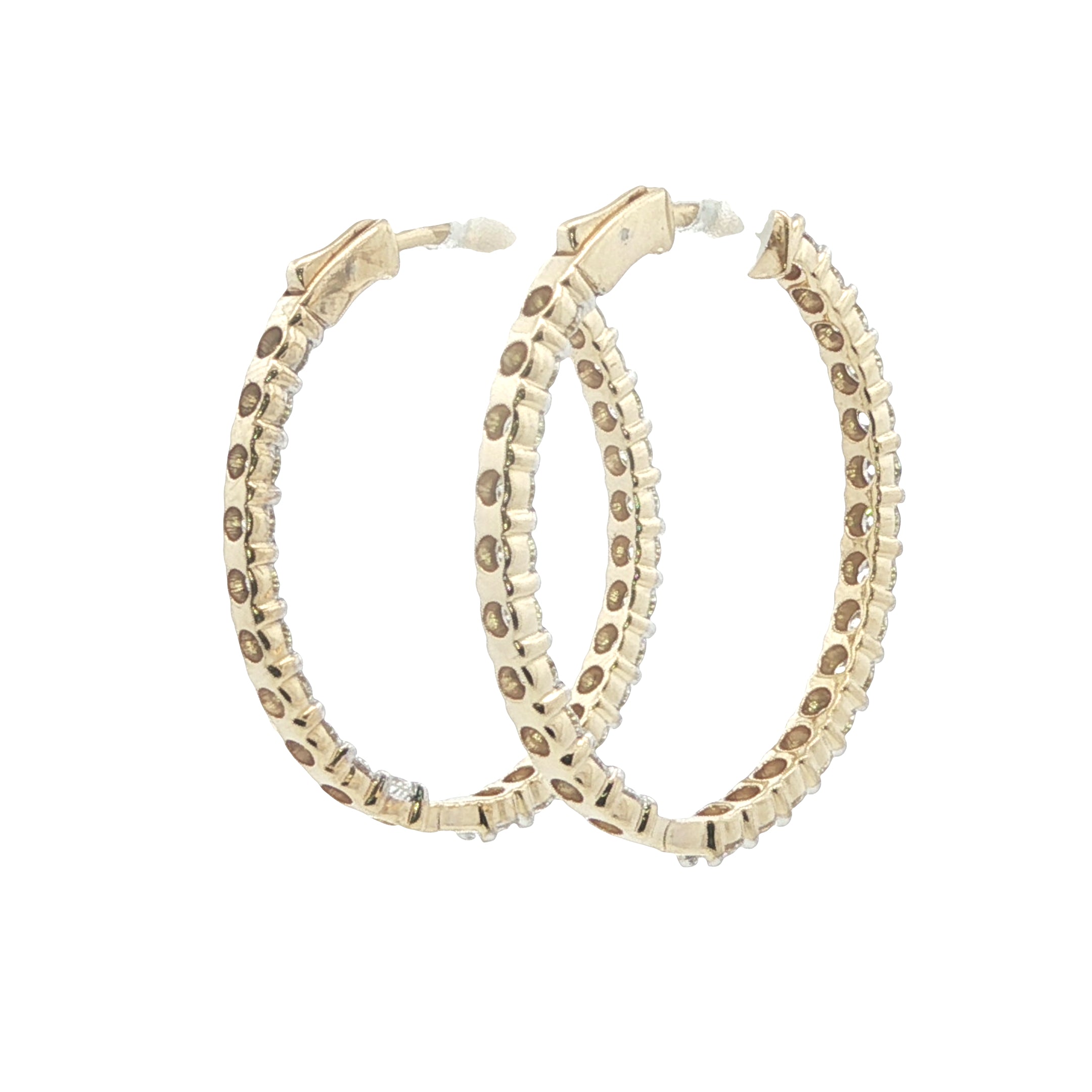 Gold hoop earrings with leopard print pattern on a white background