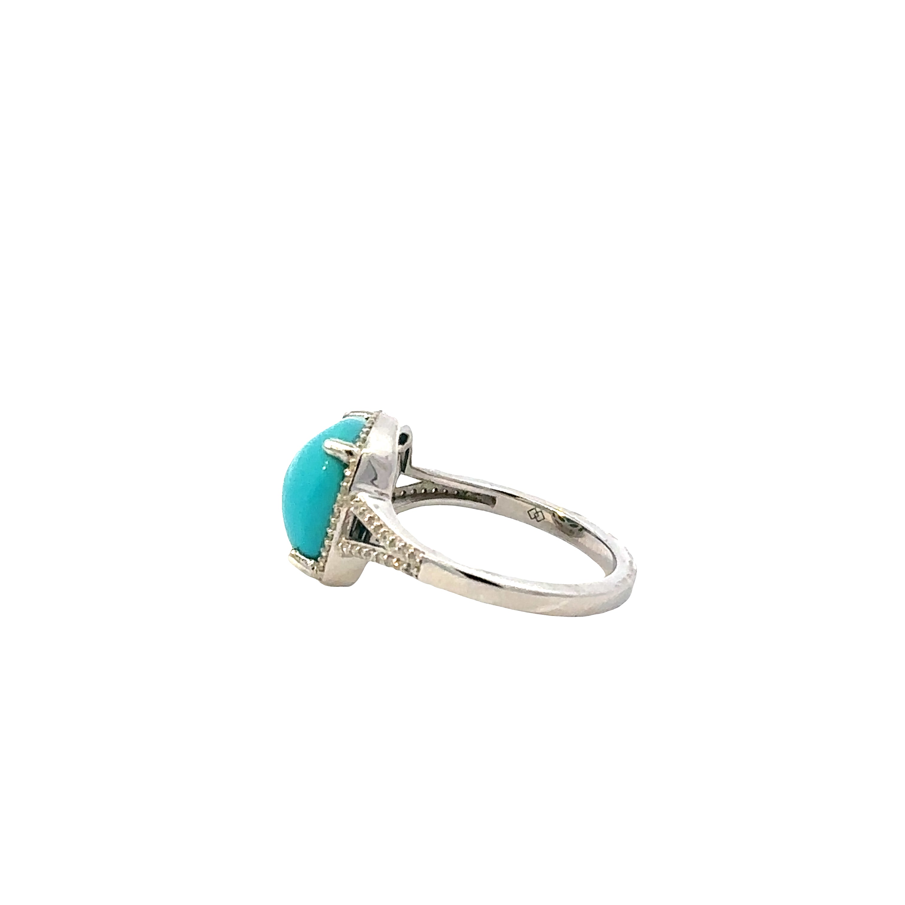 Silver ring with a turquoise stone on a white background