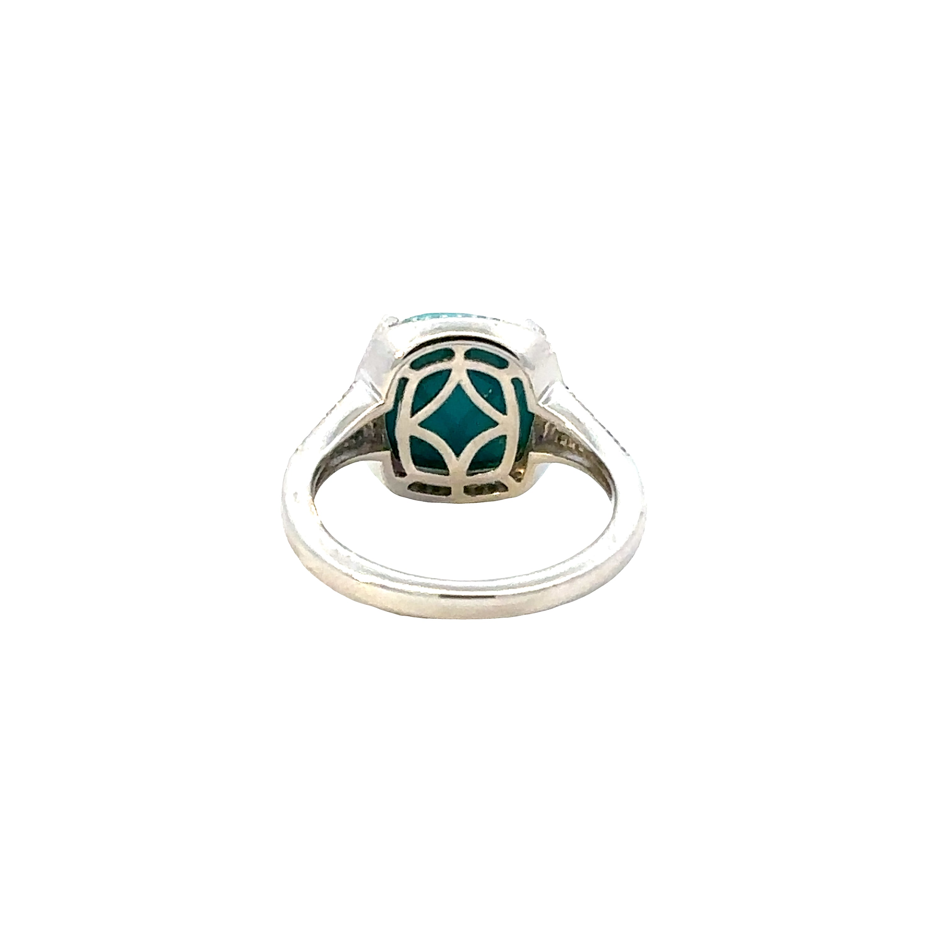 Silver ring with a green gemstone on a white background