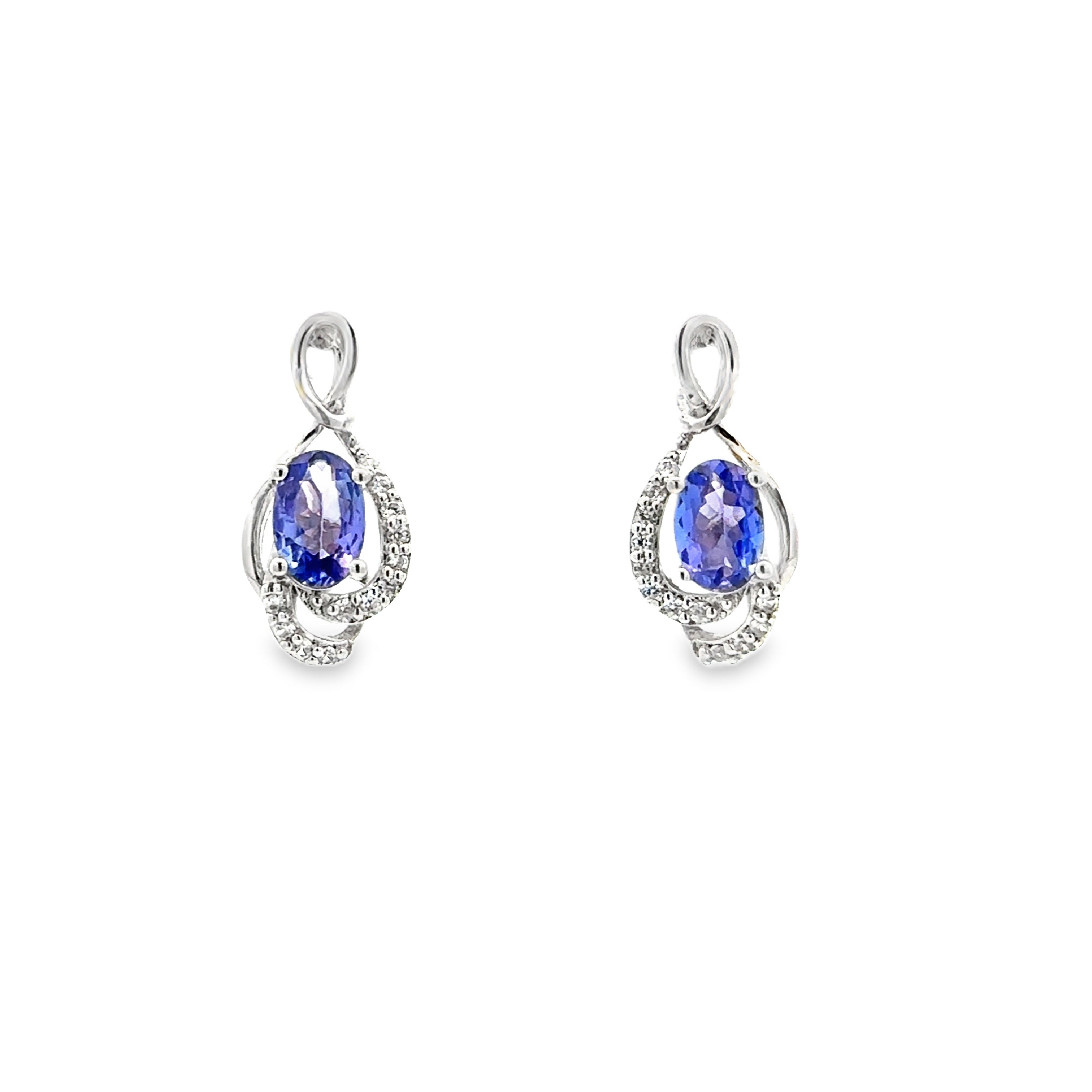 Pair of earrings with blue gemstones on a white background