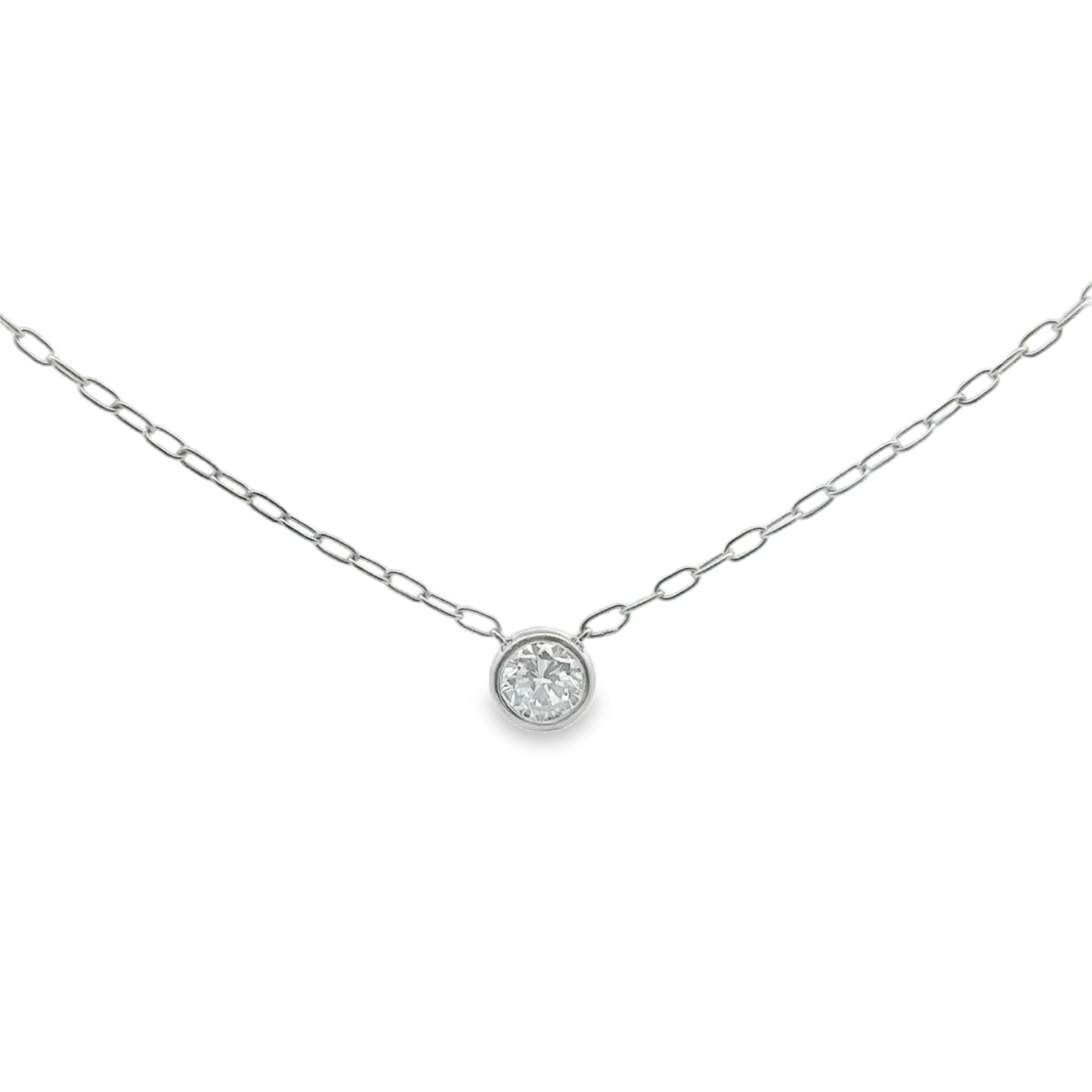 Silver necklace with a round pendant on a white background