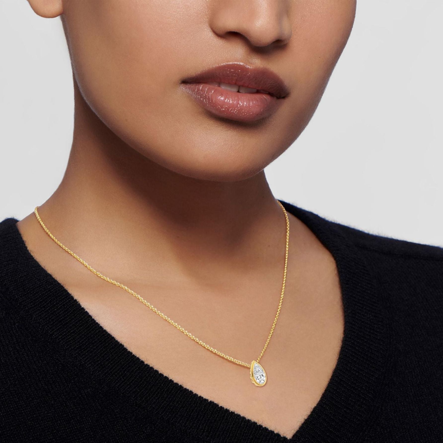Pear Bezel necklace on a white background