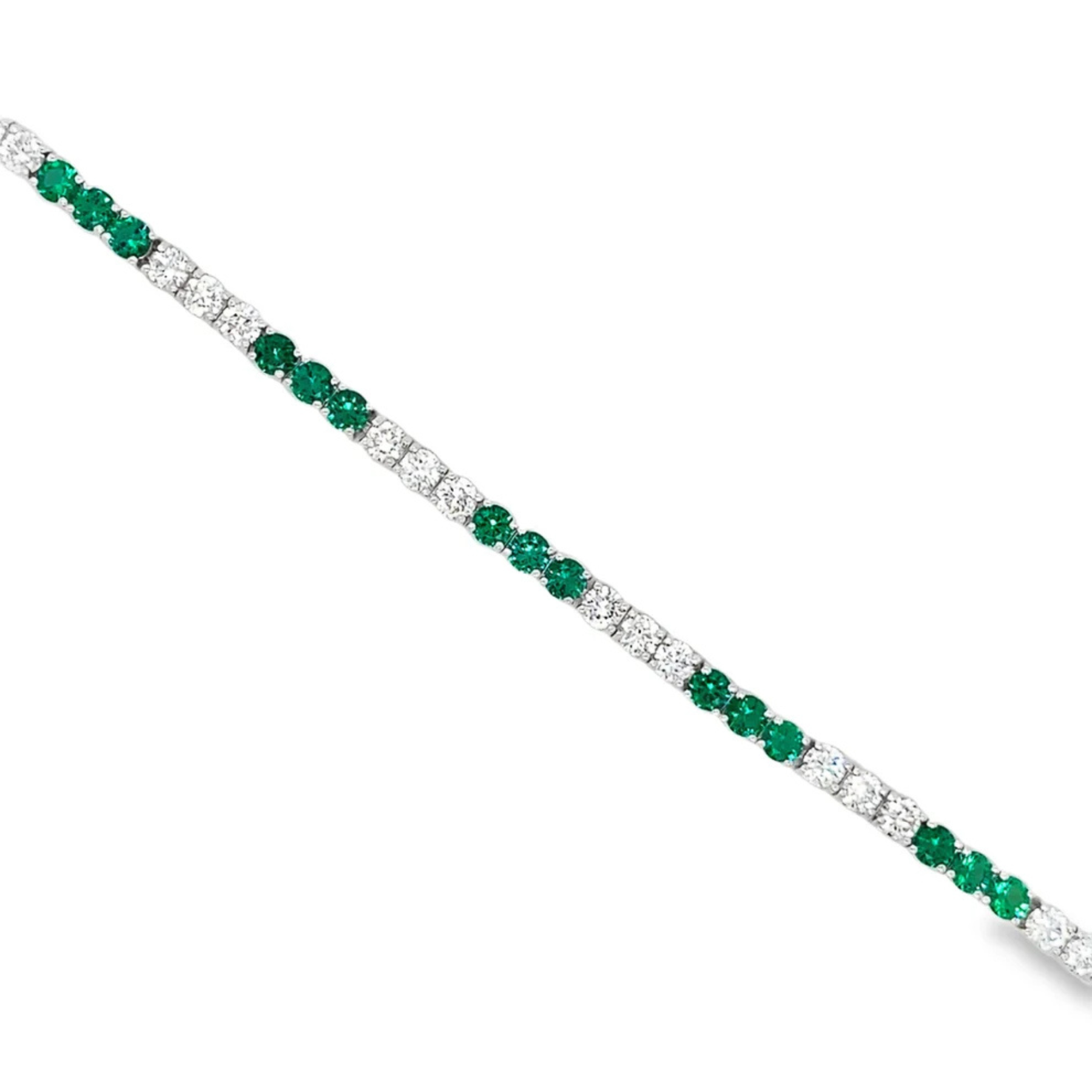 Bracelet with green gemstones and clear stones on a white background