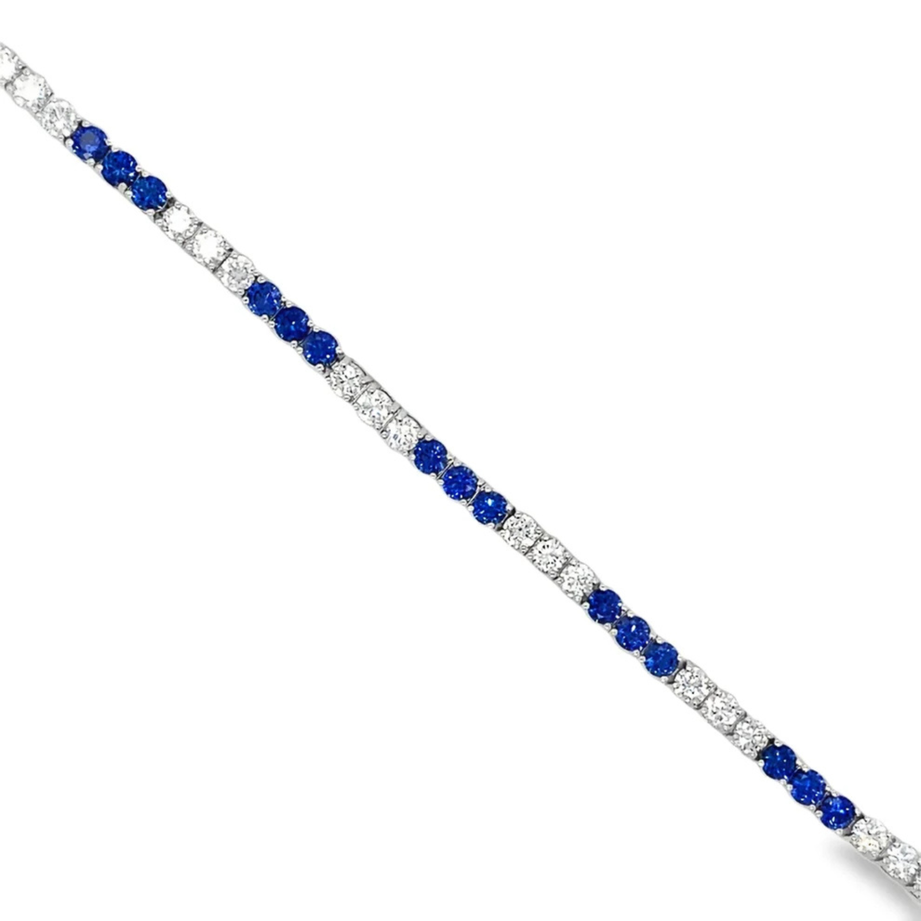 Bracelet with blue gemstones and clear stones on a white background