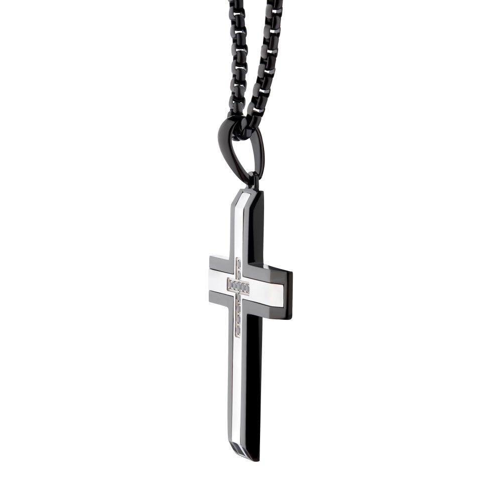 Black and silver cross necklace on a white background