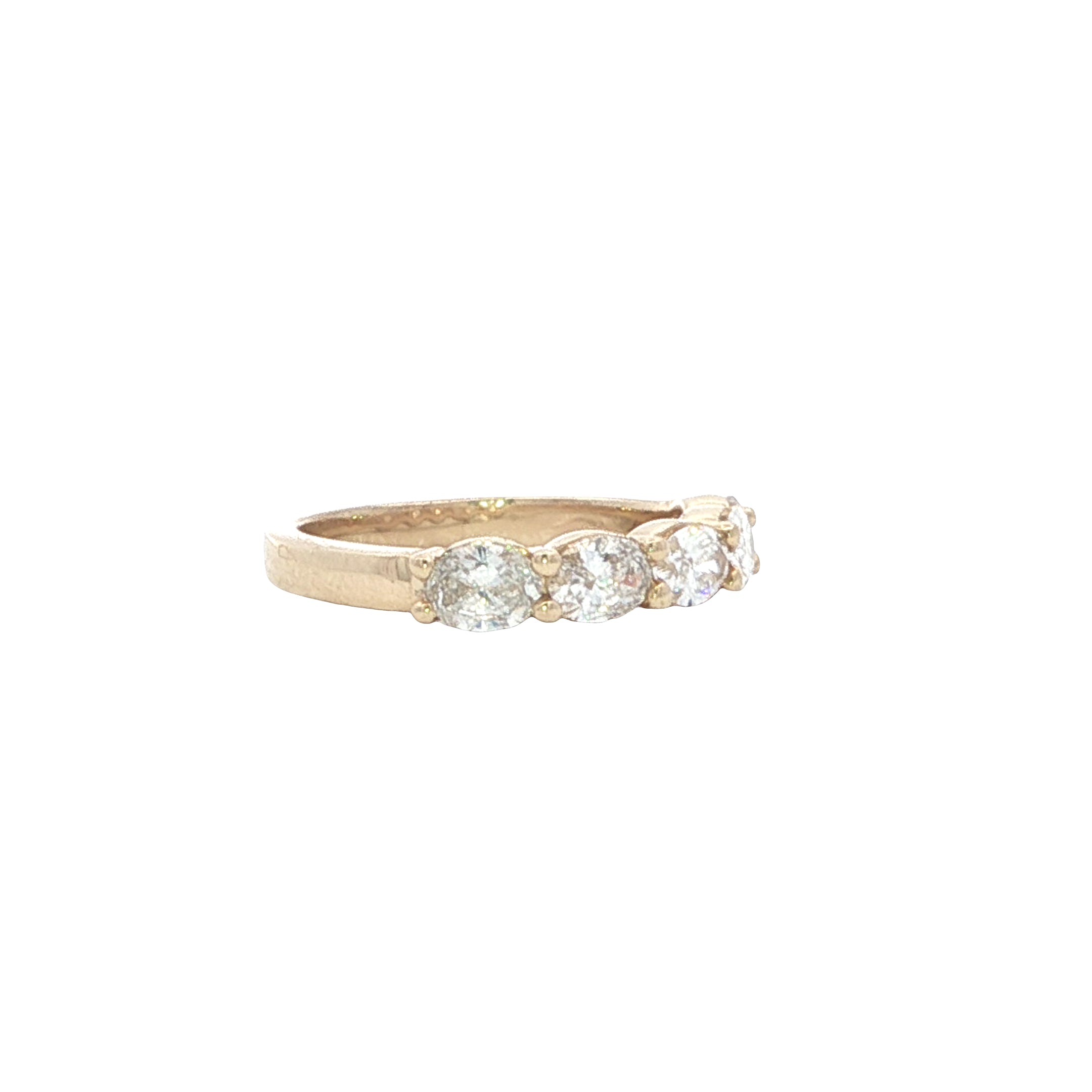 Gold ring with three diamonds on a white background