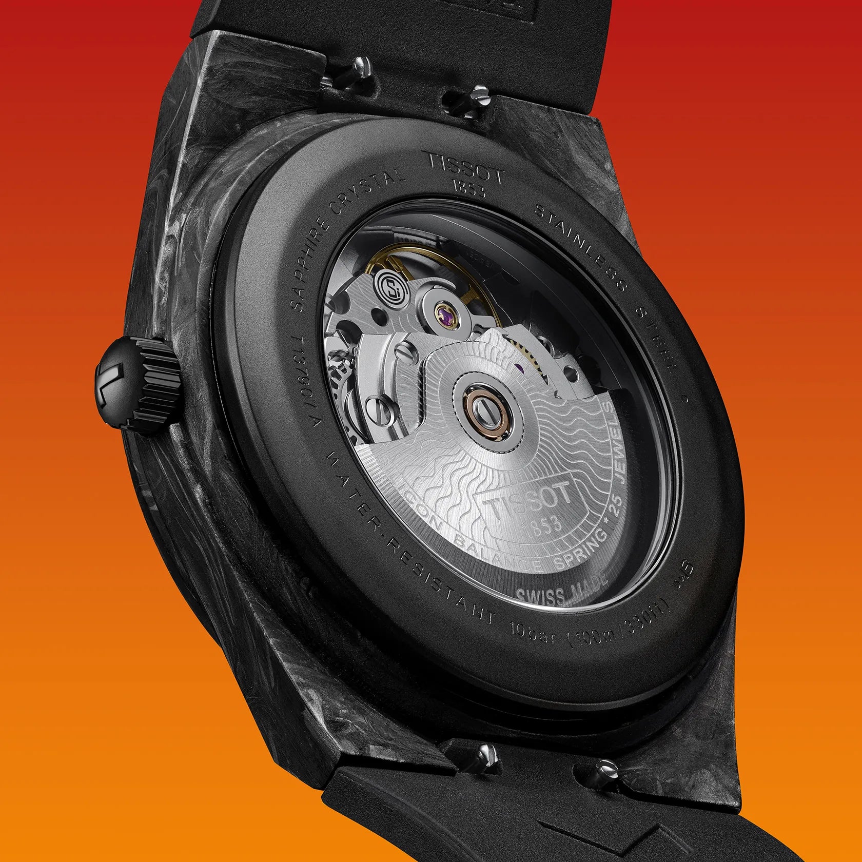 Close-up of a watch with its case back removed on an orange background
