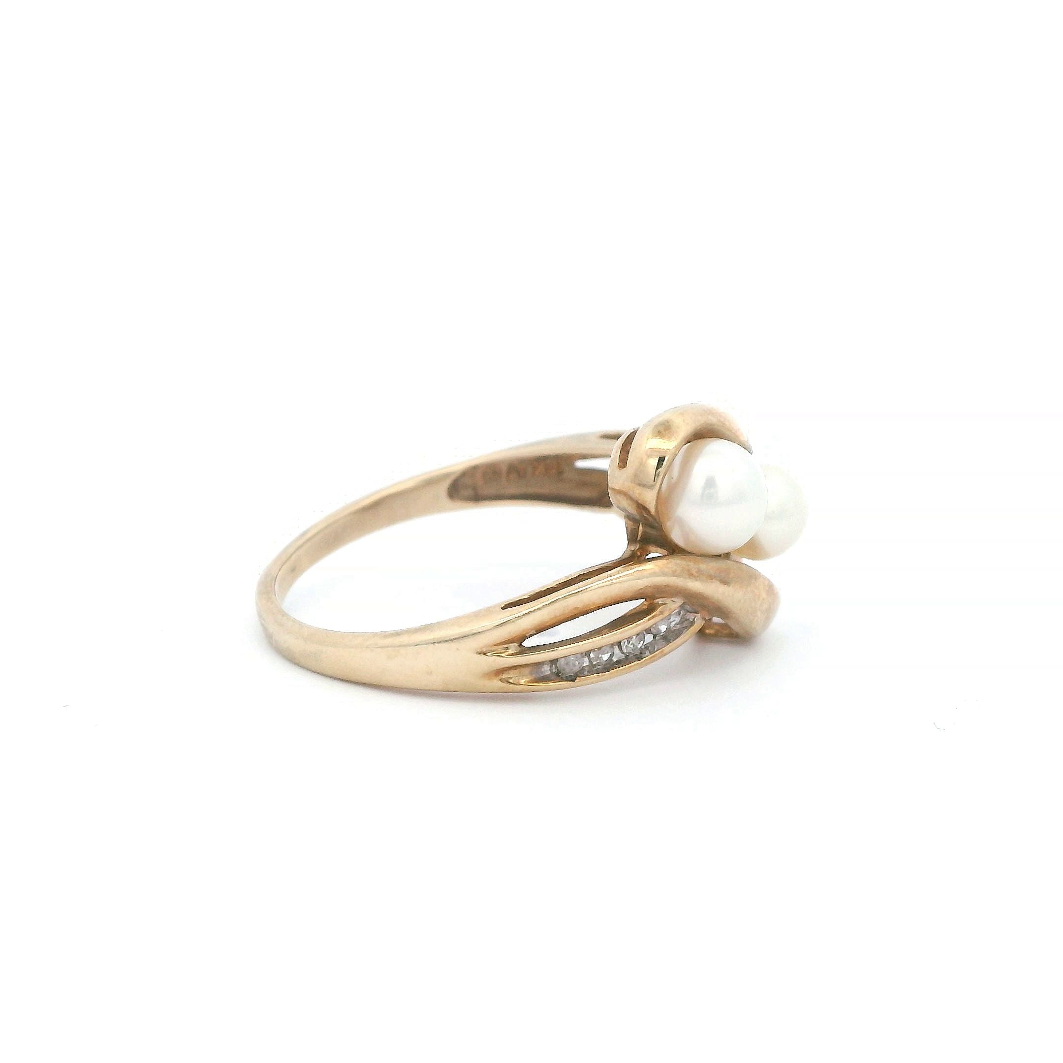Estate Collection: 10K Yellow Gold Pearl and Diamond Asymmetrical Twist Ring