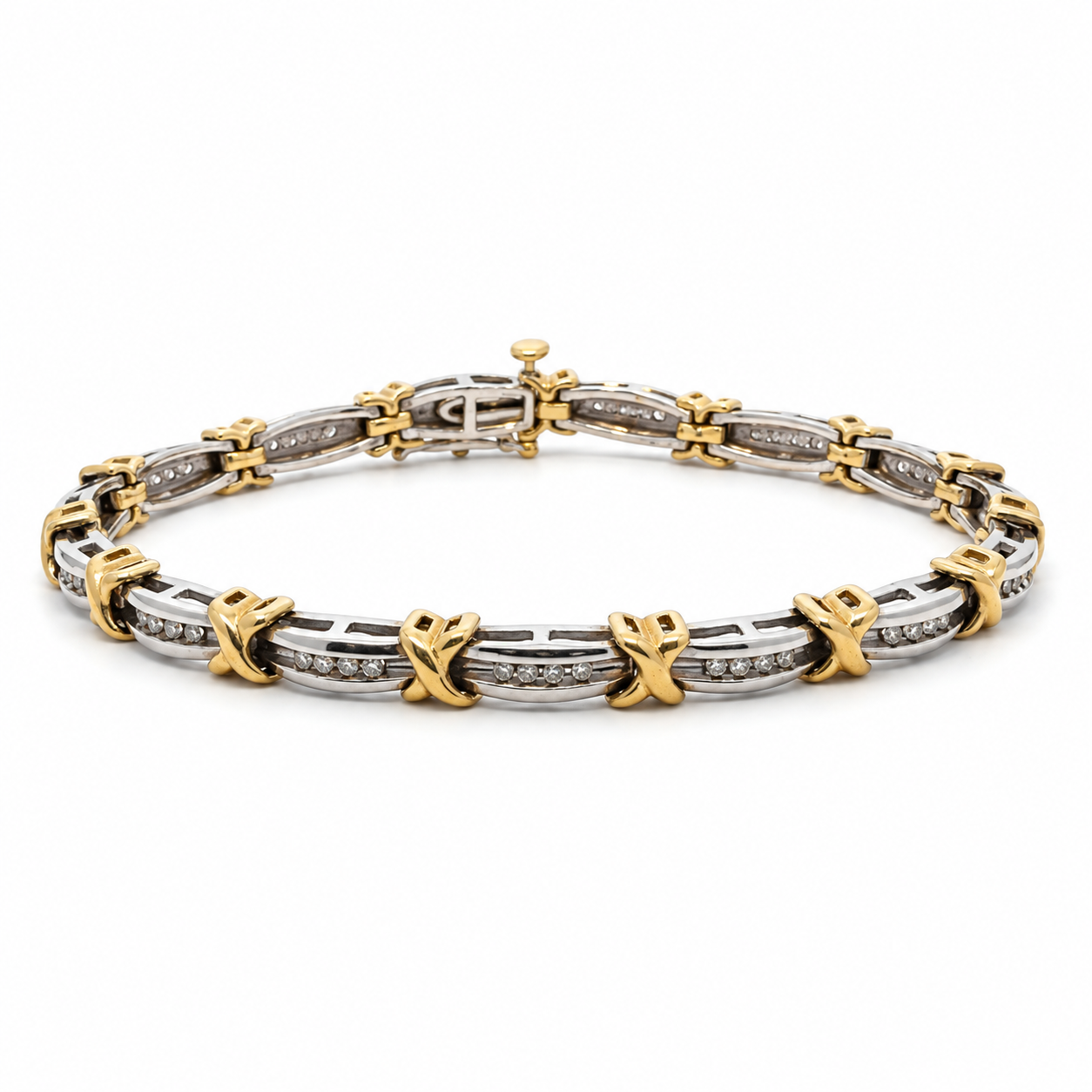 Estate 10K white and yellow gold 7-inch bracelet with 0.60CTW. channel-set diamonds and polished yellow gold X-shaped links.