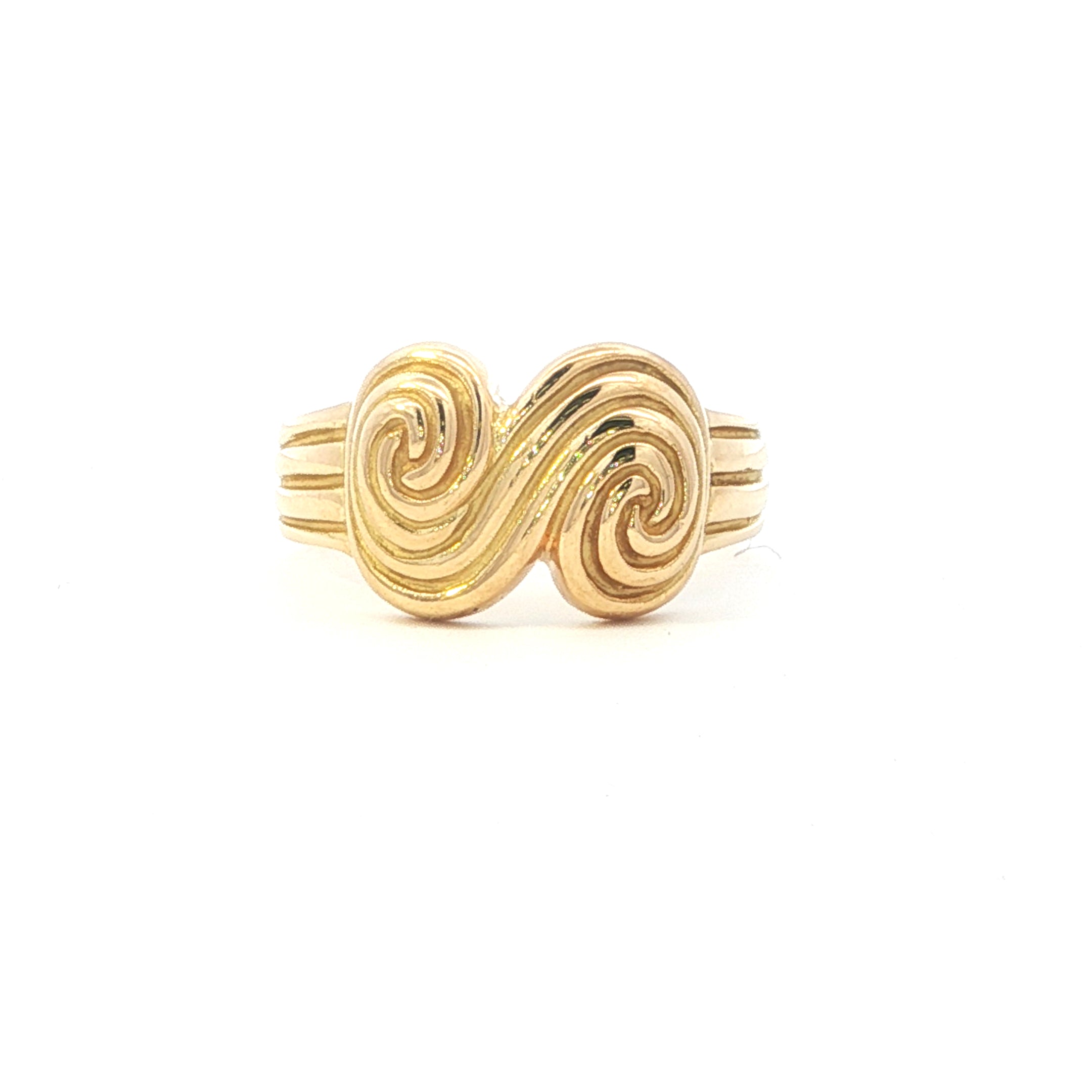 Gold ring with a spiral design on a white background