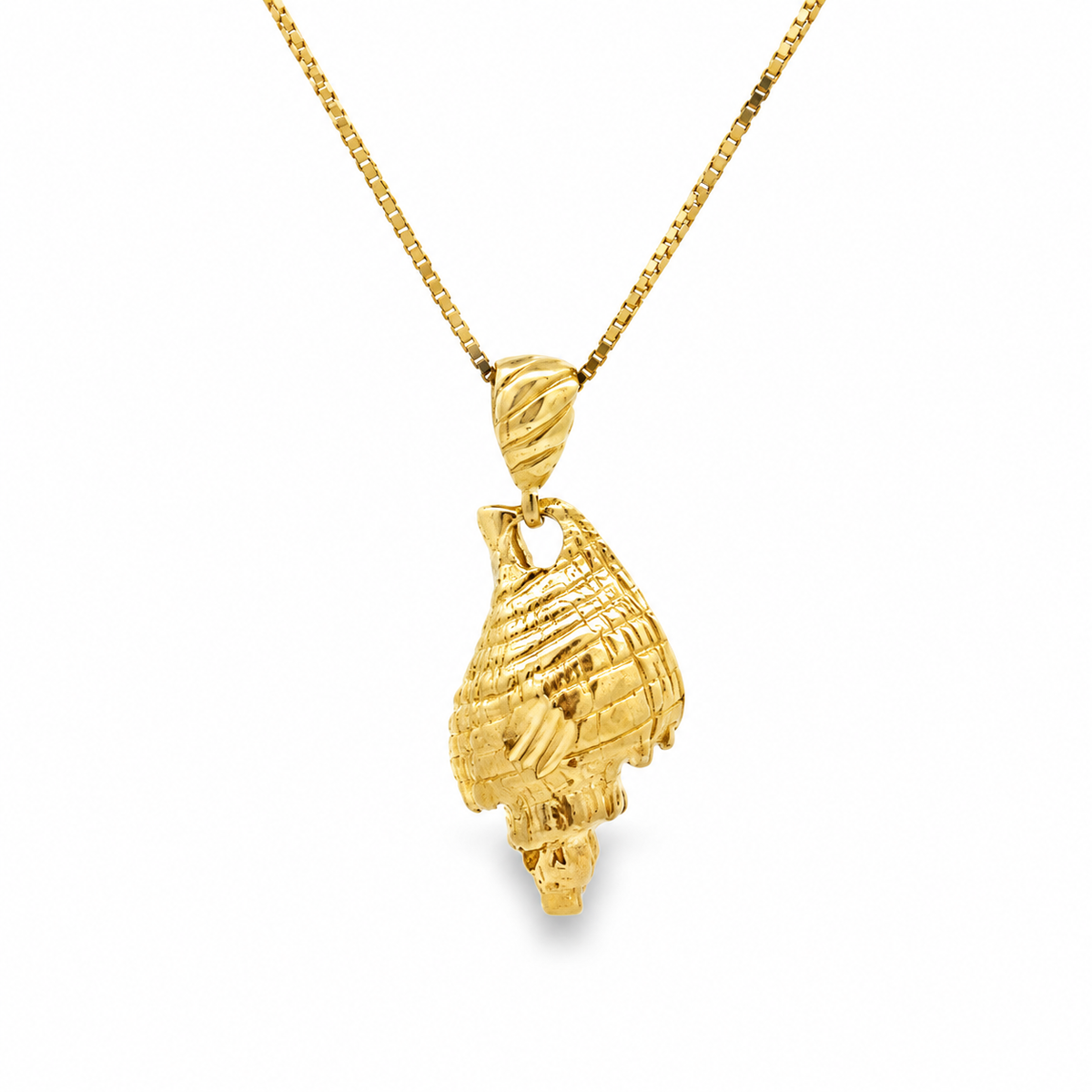 Front view of an estate 10K yellow gold sculpted seashell pendant on a new yellow gold box chain.