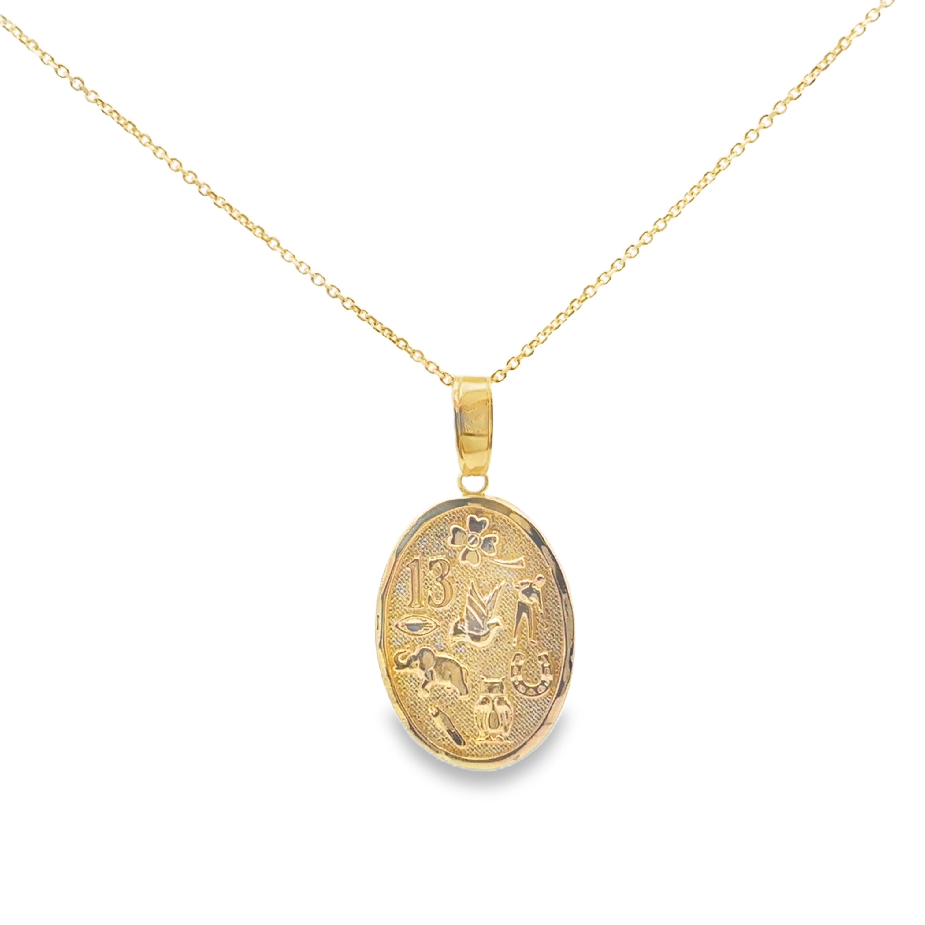 Gold necklace with an oval pendant on a white background