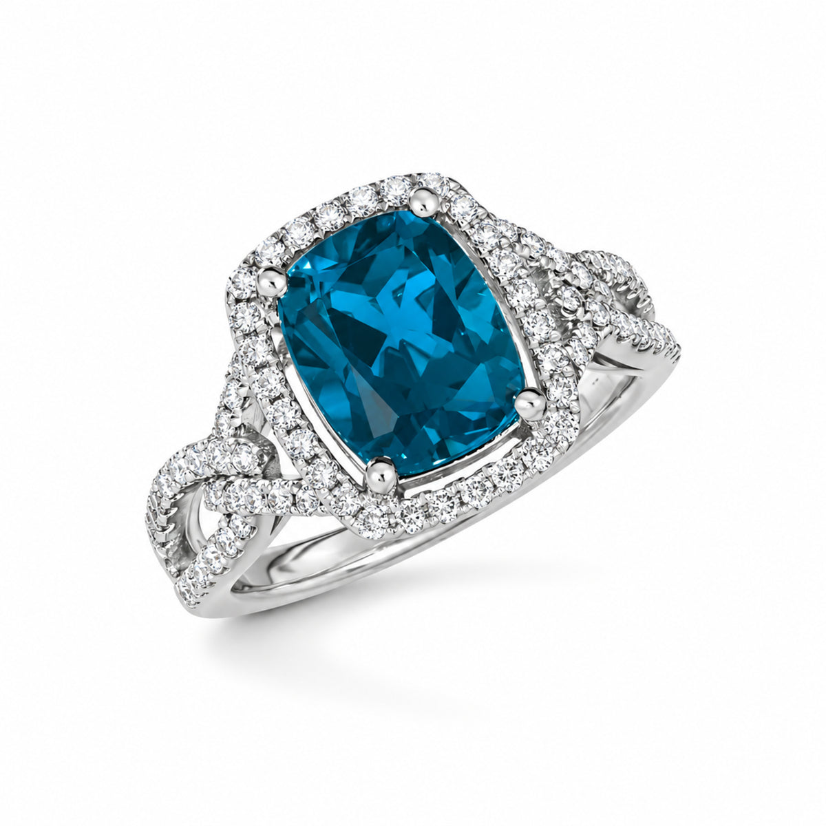 Angled view of estate Le Vian London Blue Topaz and diamond halo ring in 14K Vanilla Gold, showing the linked split shank.