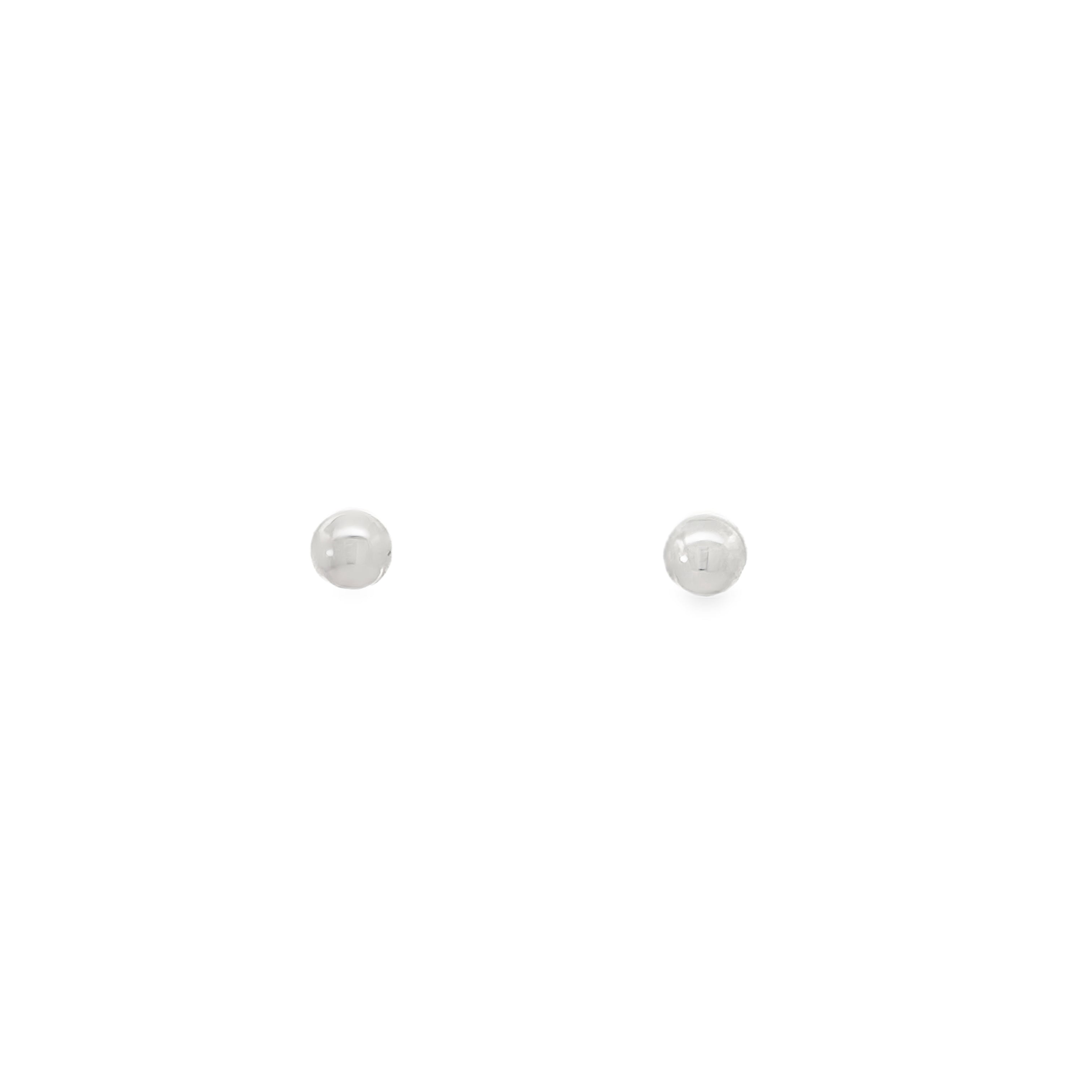 Pair of silver stud earrings on a white background