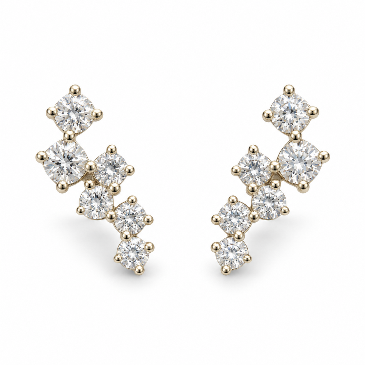 Pair of 14K yellow gold 0.25CTW. scattered diamond mini climber stud earrings, with six round diamonds on each earring.