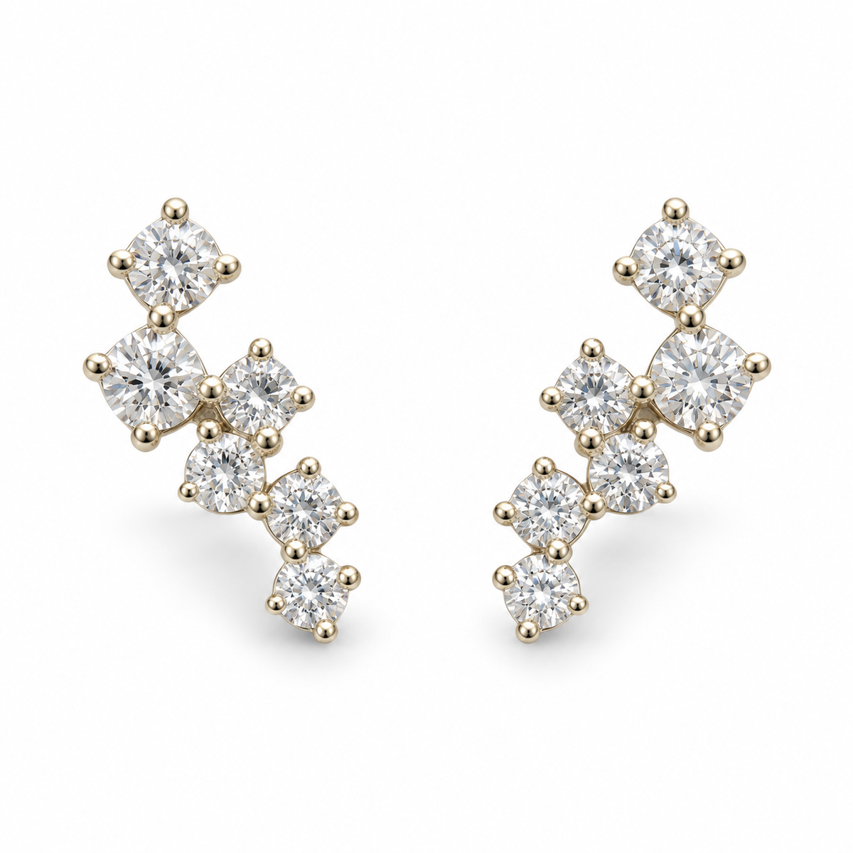 Pair of 14K yellow gold 0.25CTW. scattered diamond mini climber stud earrings, with six round diamonds on each earring.