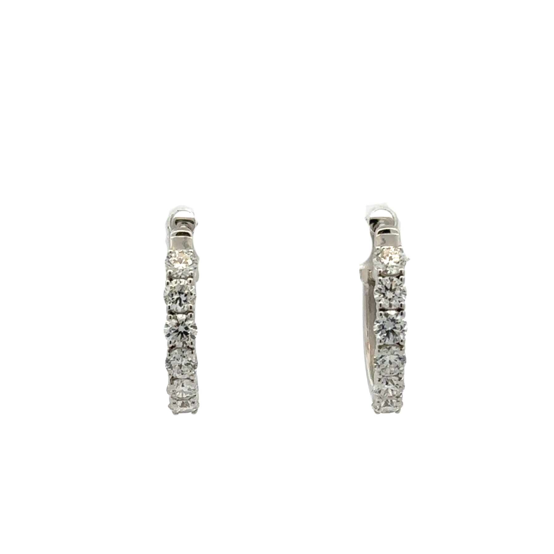 Pair of silver hoop earrings with clear stones on a white background