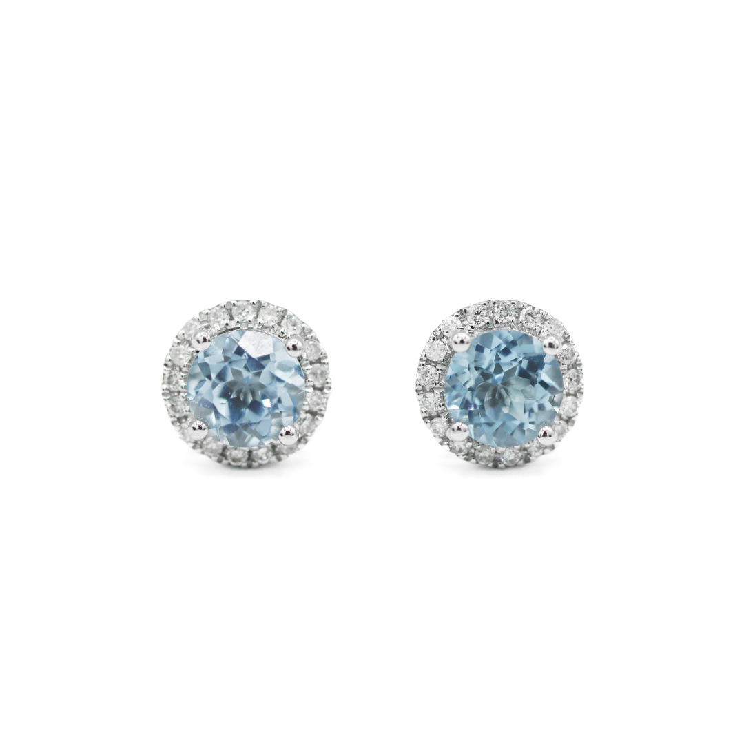 Front View of 14K White Gold 1CTW. Sky Blue Topaz & 1/6CT. Diamond Halo Stud Earrings on white background.