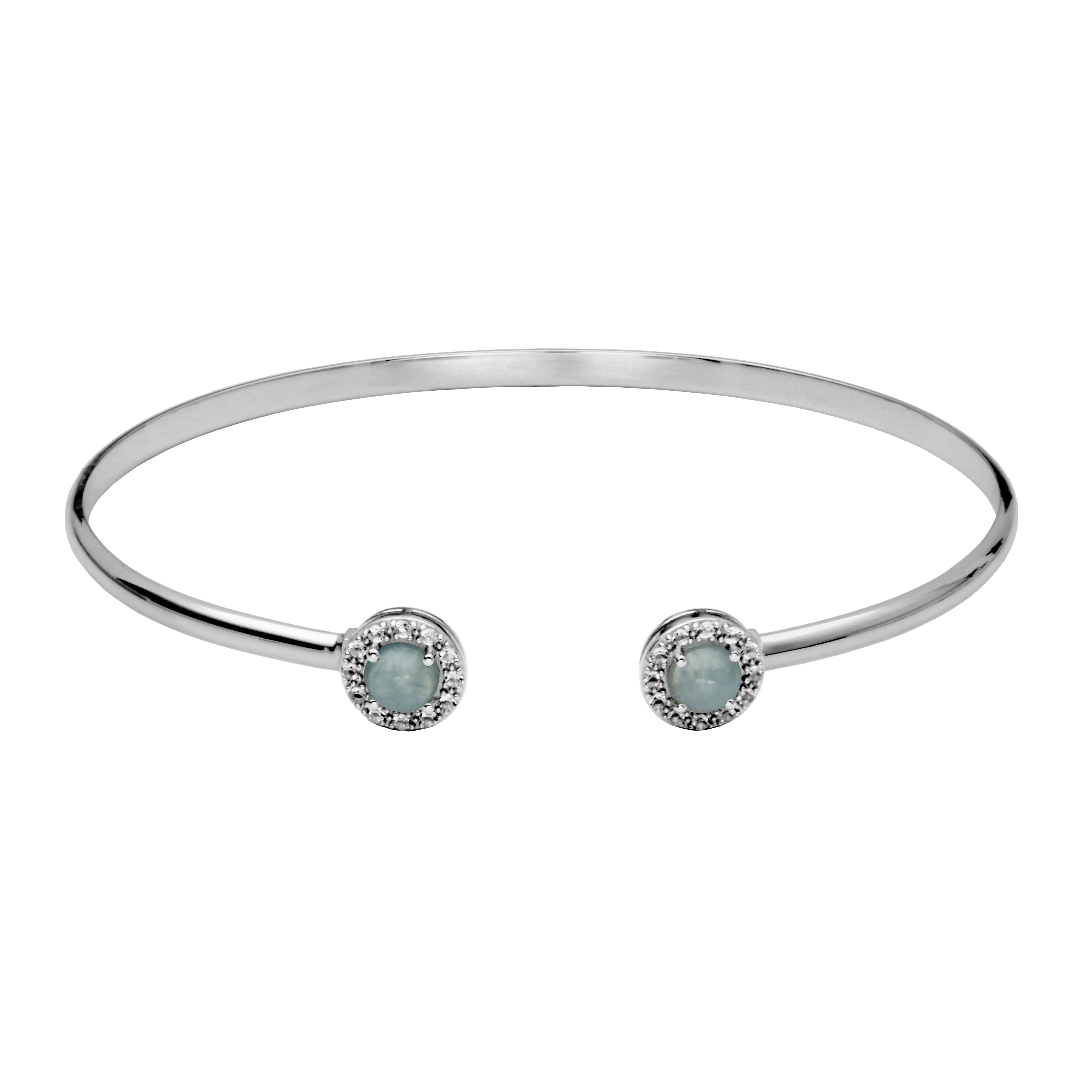 Silver Cuff Bangle Bracelet. On each end of the cuff is a round aquamarine cabachon surrounded by a hold of white topaz gemstones.