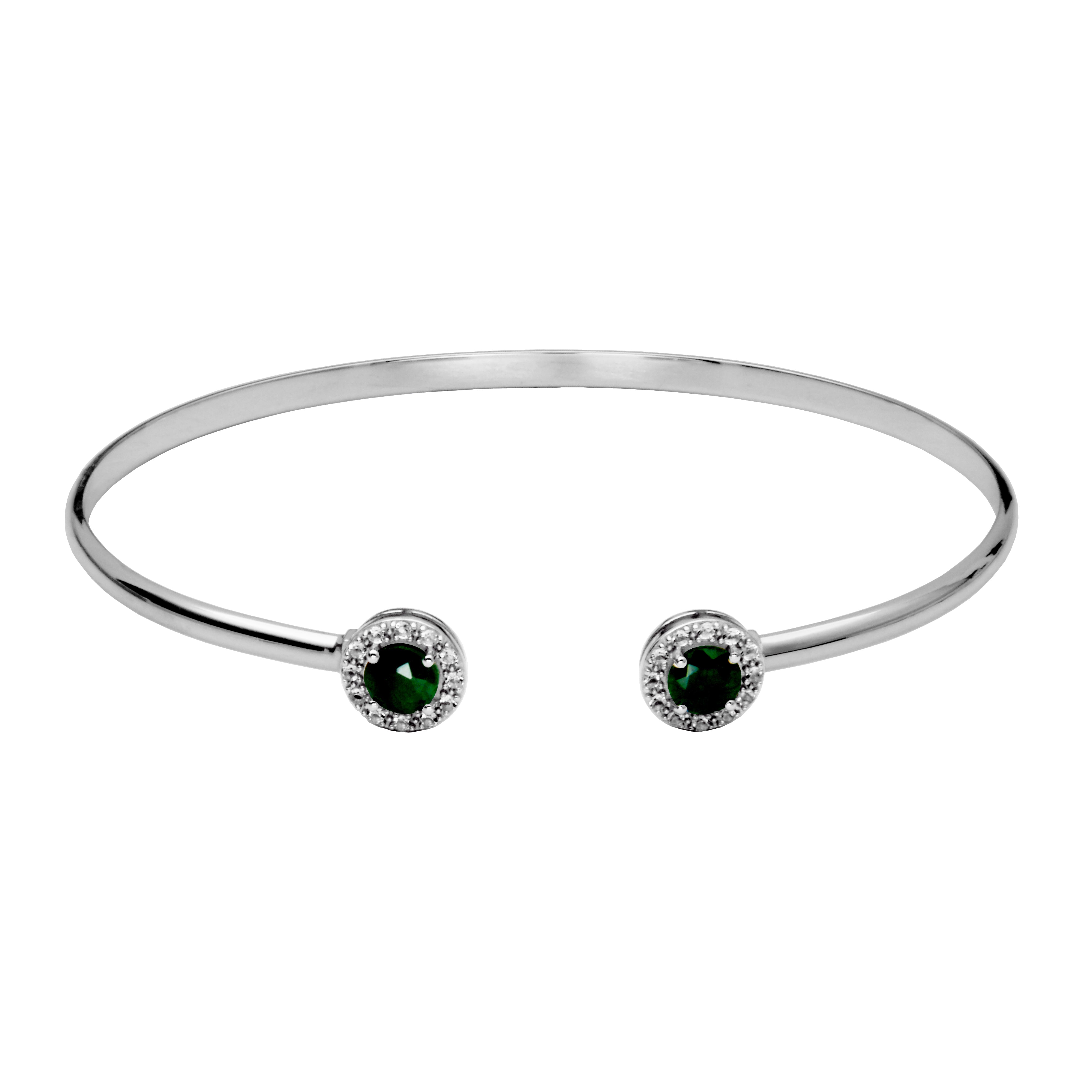 Silver Cuff Bangle Bracelet. On each end of the cuff is a round emerald surrounded by a halo of white topaz gemstones.