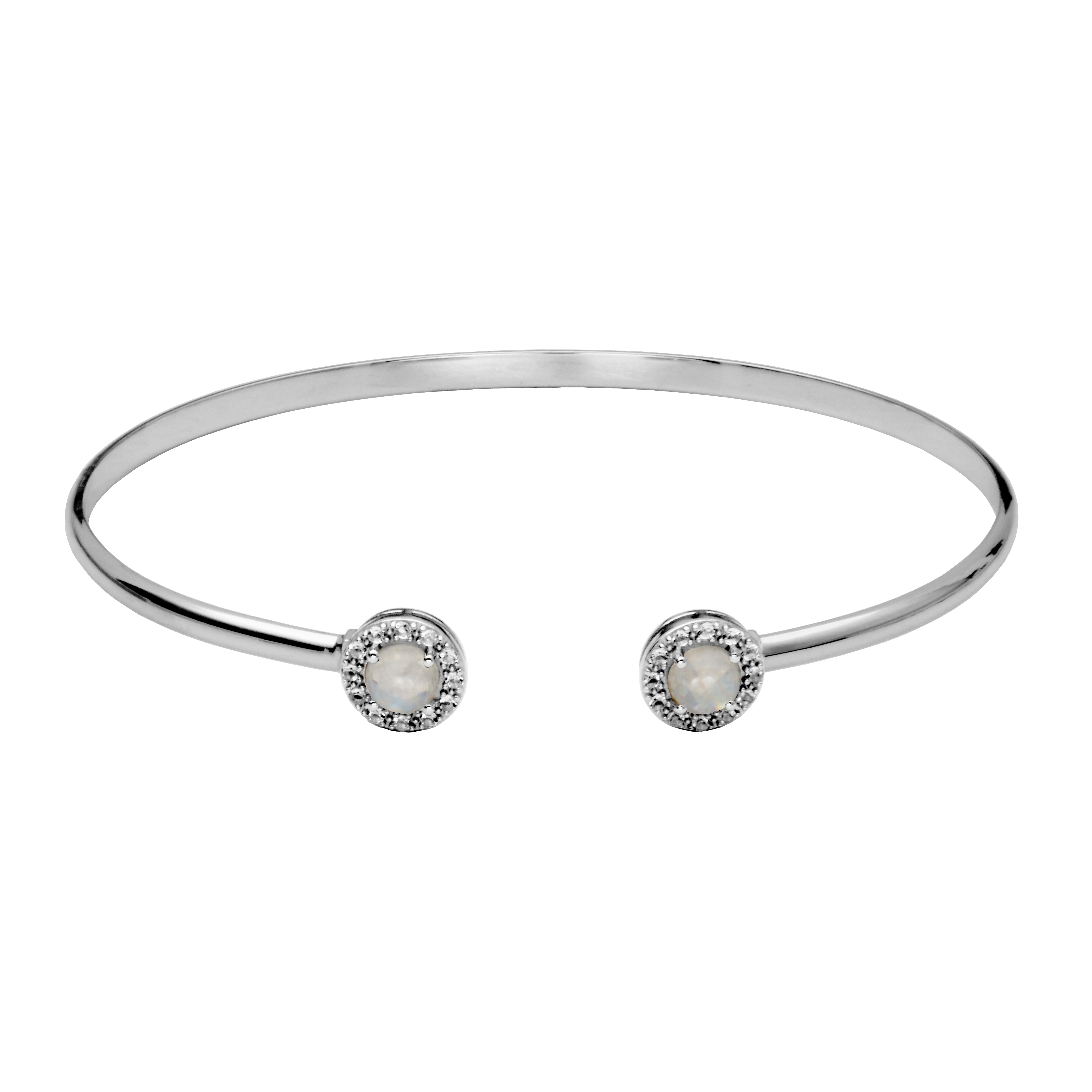 Picture of cuff bangle bracelet. On the ends of the cuff is a round moonstone with a halo of white topaz gemstones.