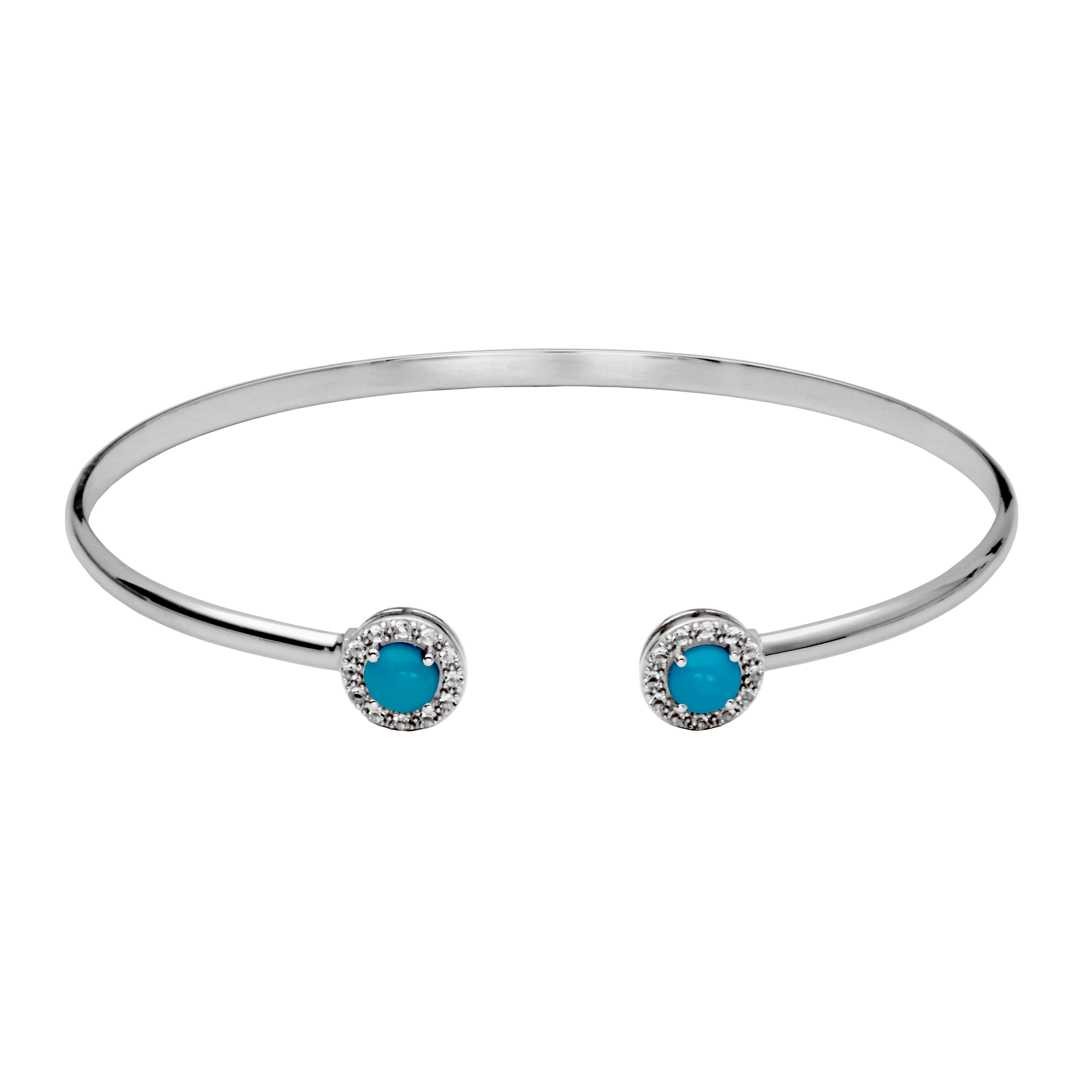 Picture of round blue turquoise with white topaz halo on the ends of a sterling silver cuff bangle.