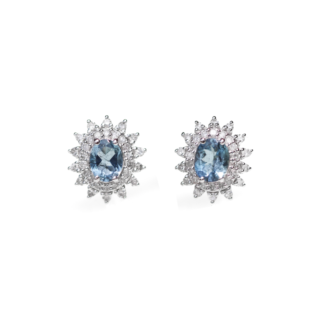 Front View of 14K White Gold 1/4CT. Diamond & Aquamarine Starburst Earrings on white background.