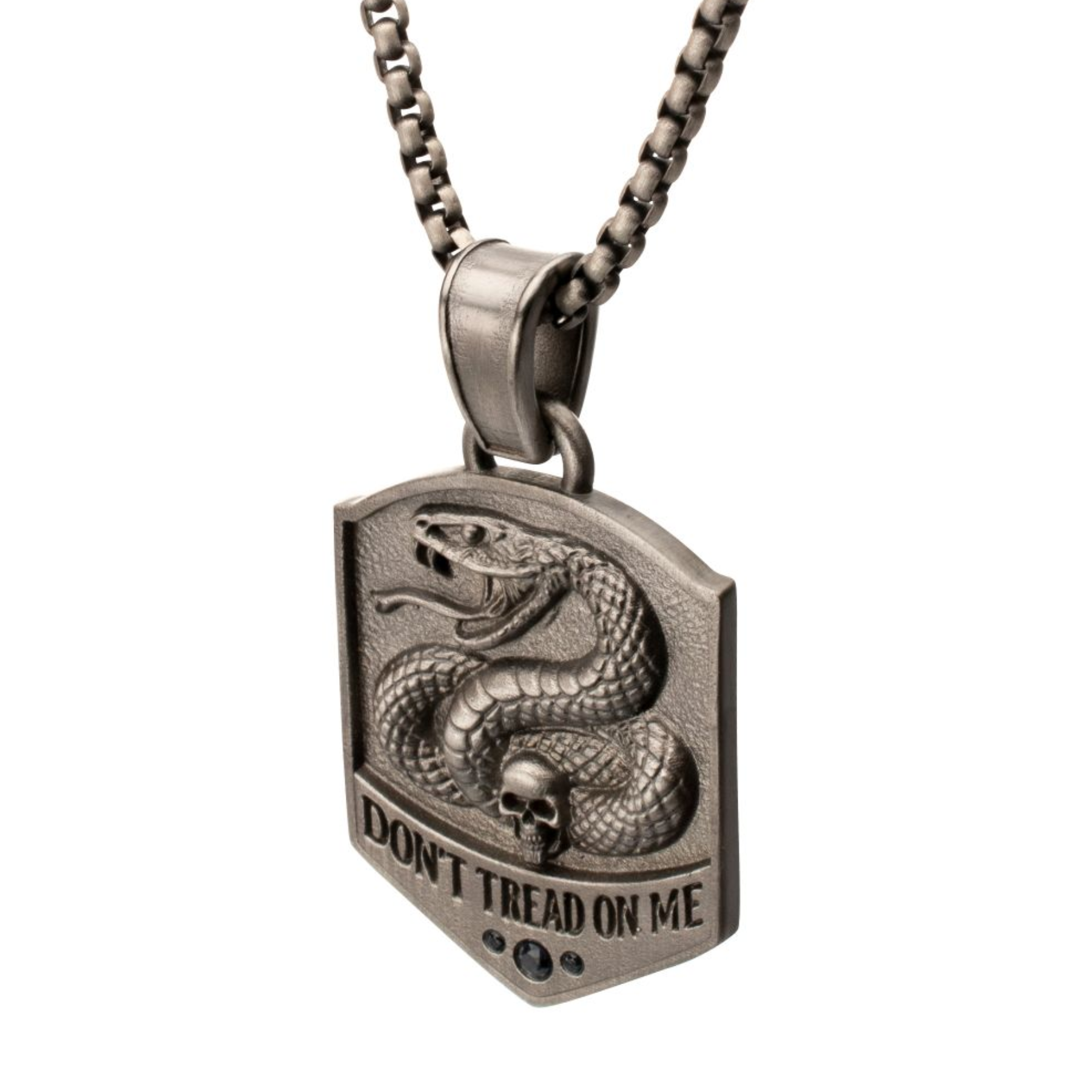 Silver pendant with snake design and 'Don't Tread on Me' text on a white background