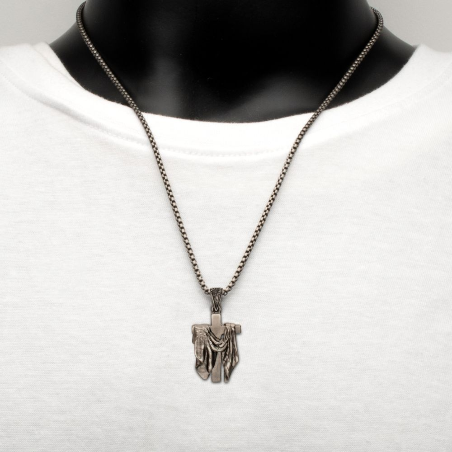 Necklace with a pendant on a mannequin against a white background