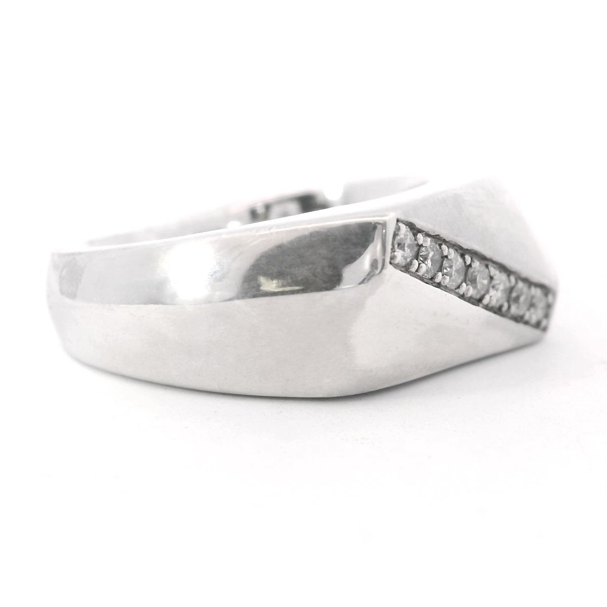 Angled to the right view of Sterling Silver Men's Diamond Wedding Ring laying flat on a white background.