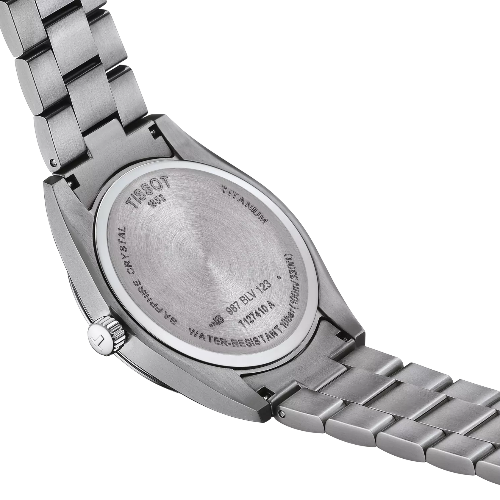 Close-up of a Tissot watch with a metallic band on a white background