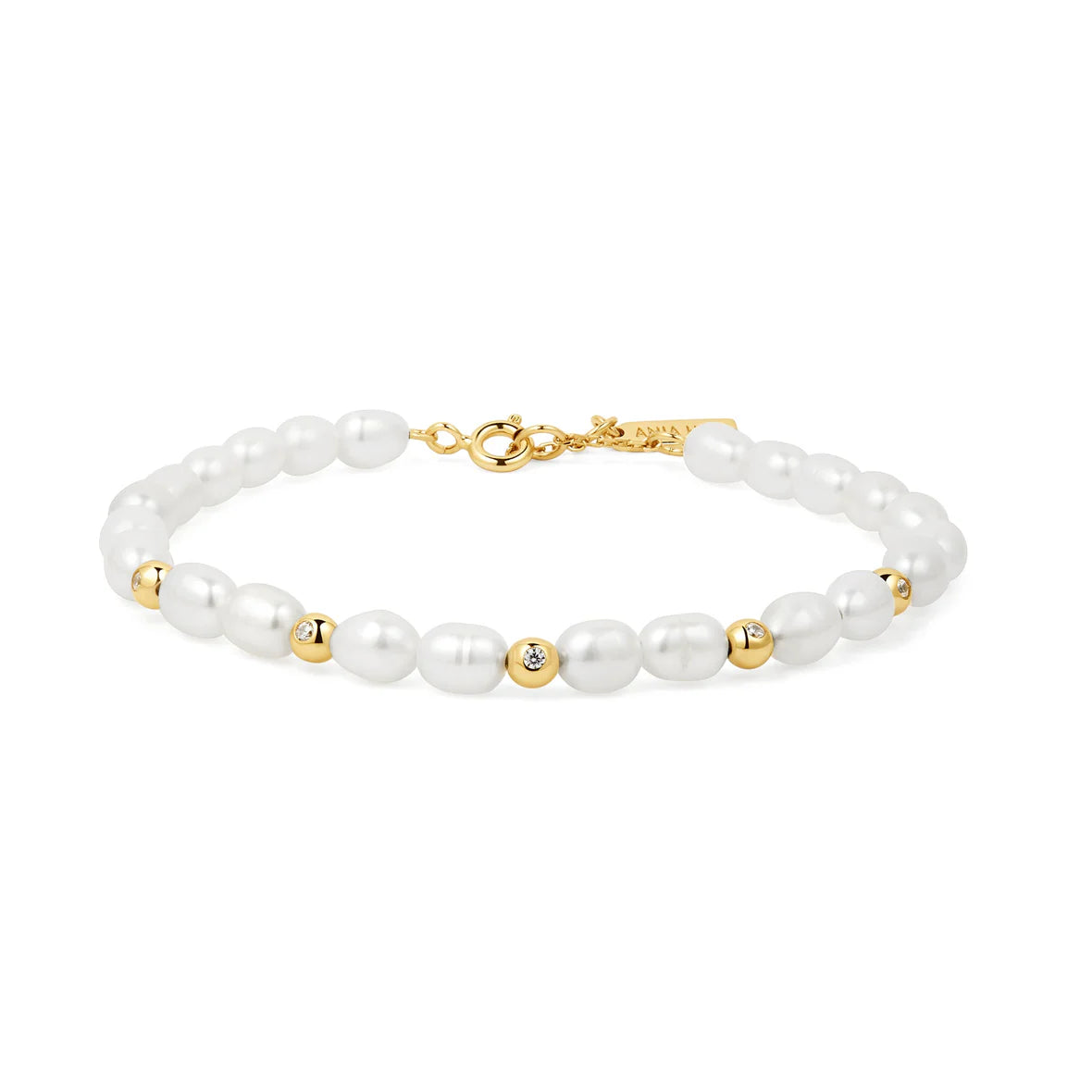 Pearl beaded bracelet on white background by ania haie 
