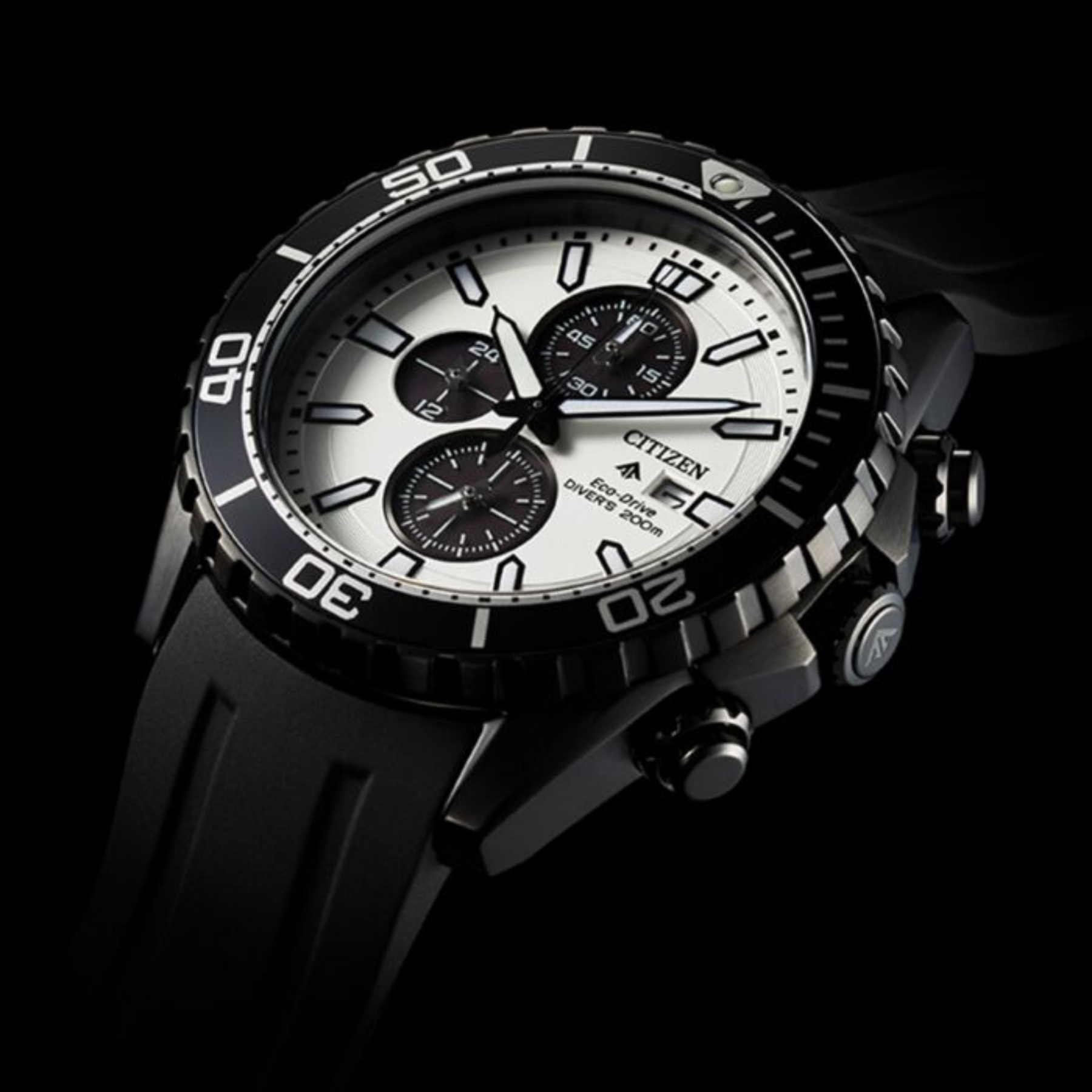 Citizen watch with black and white design on a dark background