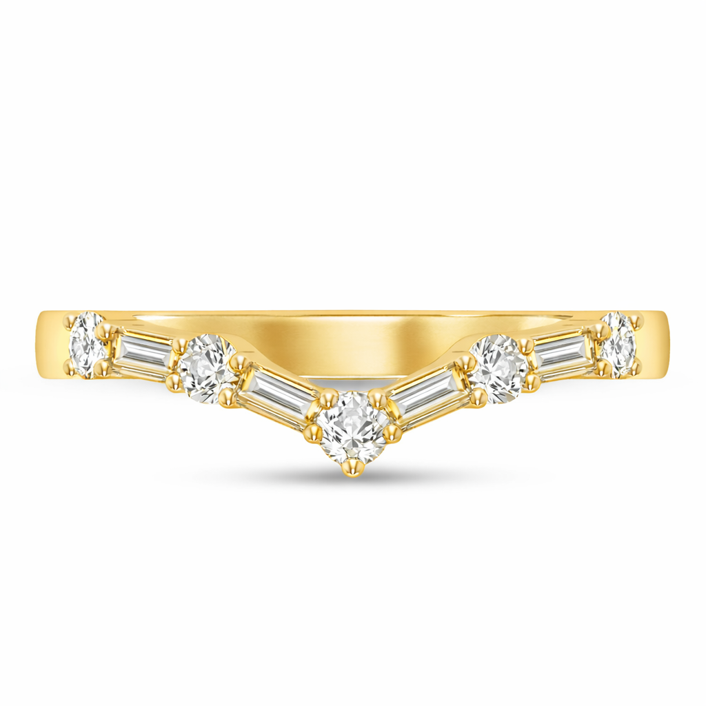 Gold ring with heart-shaped and baguette diamonds on a white background
