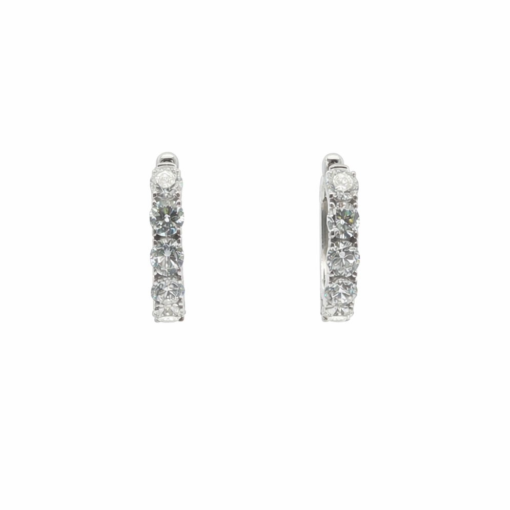 Pair of silver hoop earrings on a white background