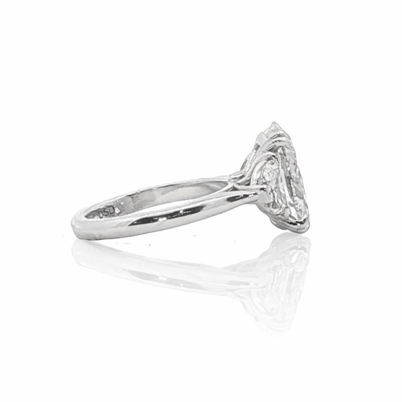 Silver ring with a diamond on a white background